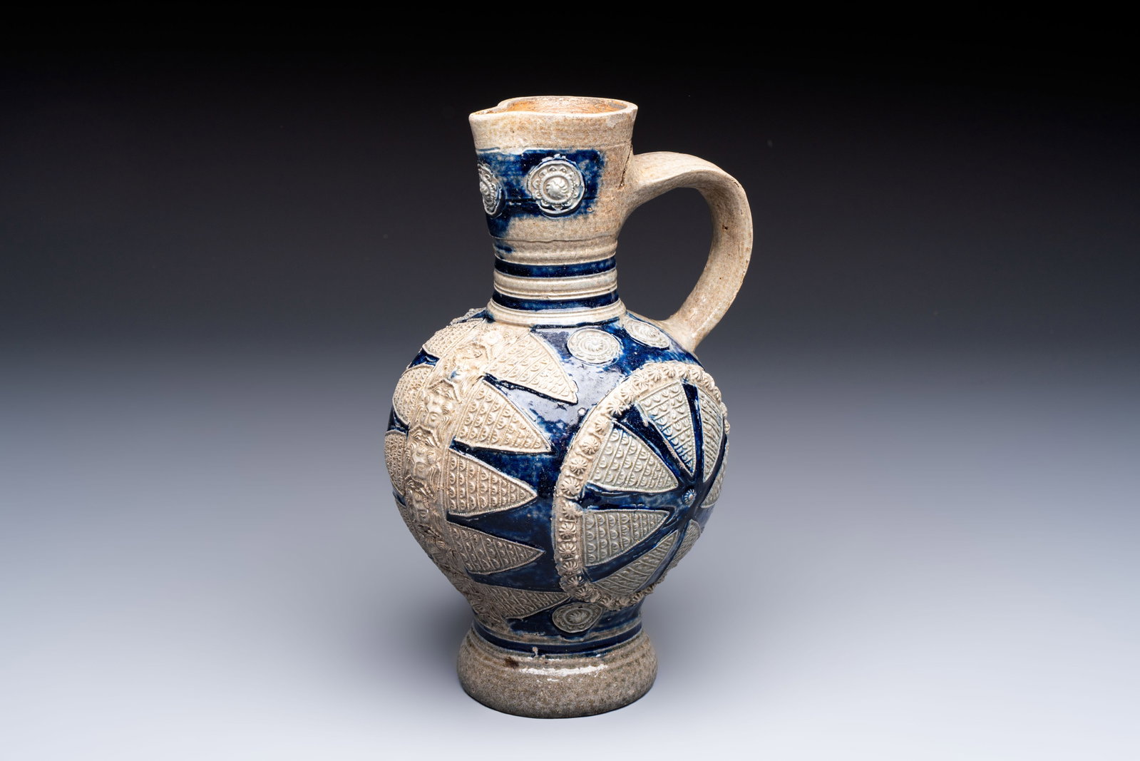 A Westerwald stoneware jug with moulded design, Germany, 17th C. (1 of 7)