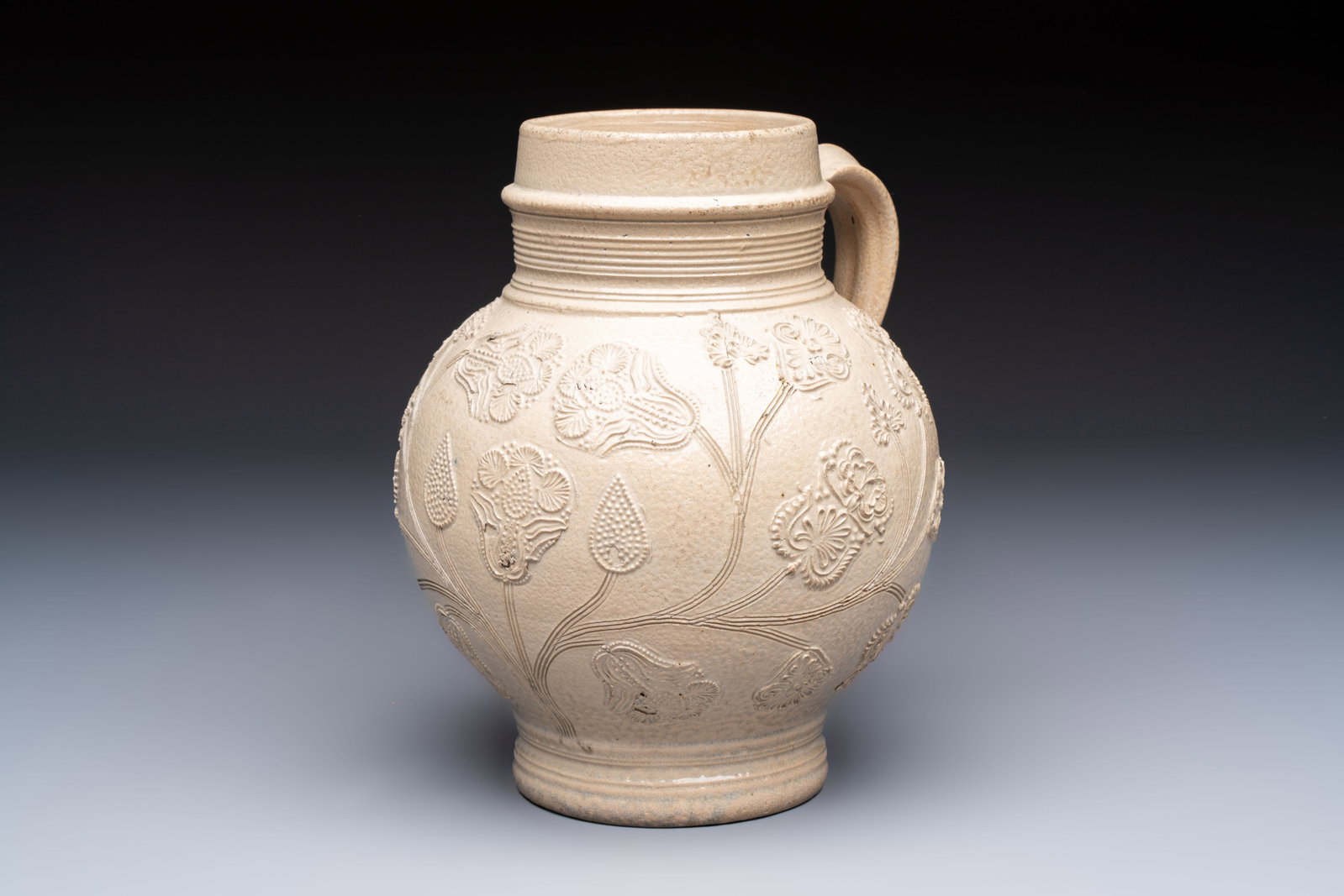 A Westerwald stoneware jug or 'Kugelbauchkrug' with floral design, Germany, 17/18th C. (1 of 7)