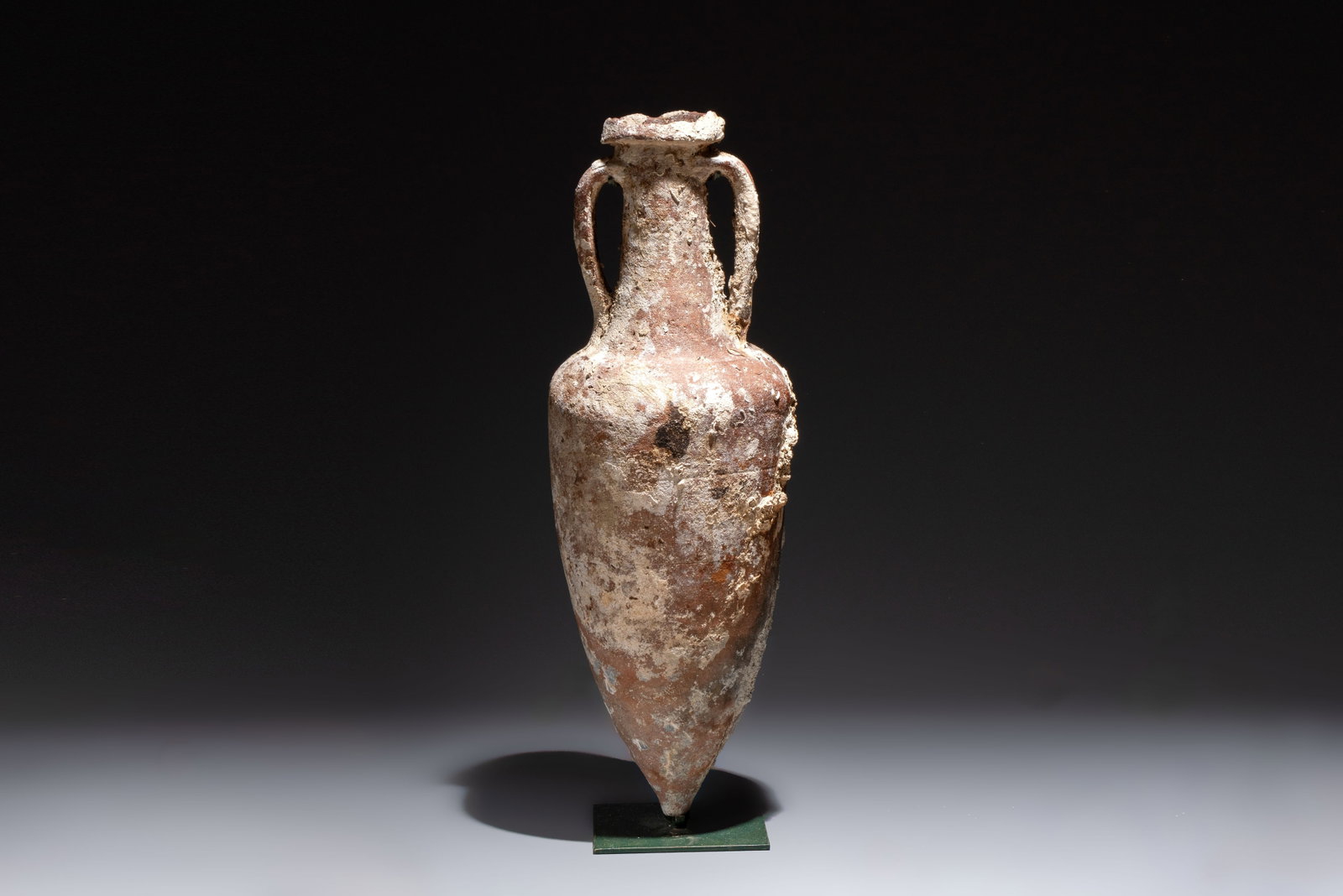 A Roman pottery fish oil or wine transport amphora with marine encrustation, South of Spain, 1st C. (1 of 9)