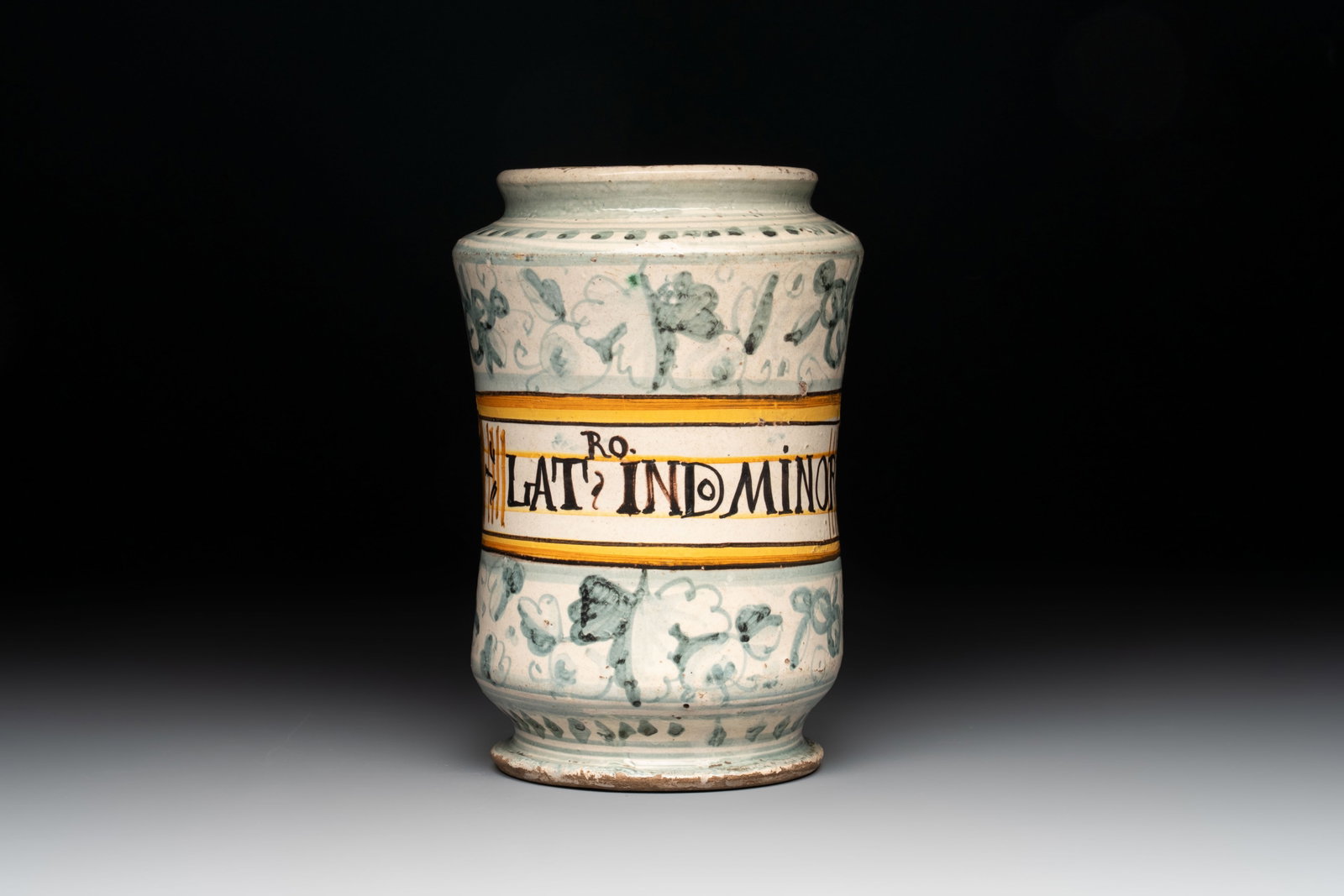 A polychrome Italian albarello inscribed 'RO. LAT: IND. MINOR', Montelupo, 17th C. (1 of 6)