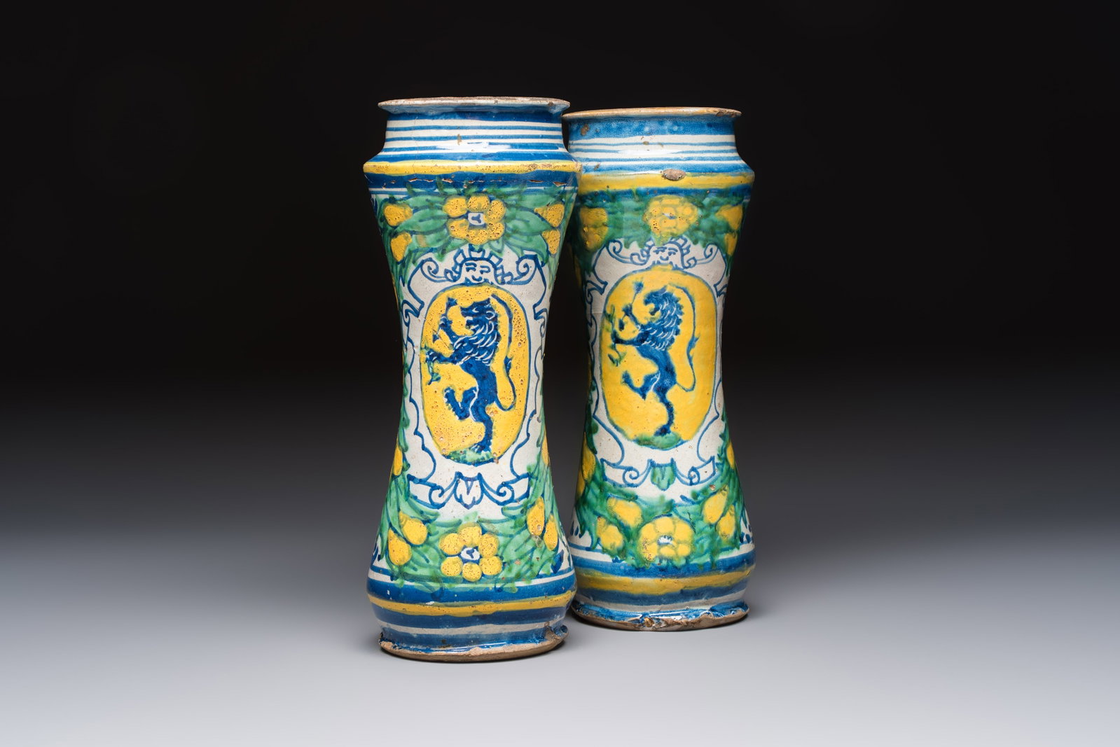 A pair of polychrome Italian maiolica armorial albarelli, Trapani, ca. 1600: A pair of polychrome Italian maiolica armorial albarelli, Trapani, ca. 1600 H.: 30 cm (the tallest) H.: 29,3 cm (the smallest) Ref.: Christie's London, 7 June 2011, lot 55 for an identical, single, ex