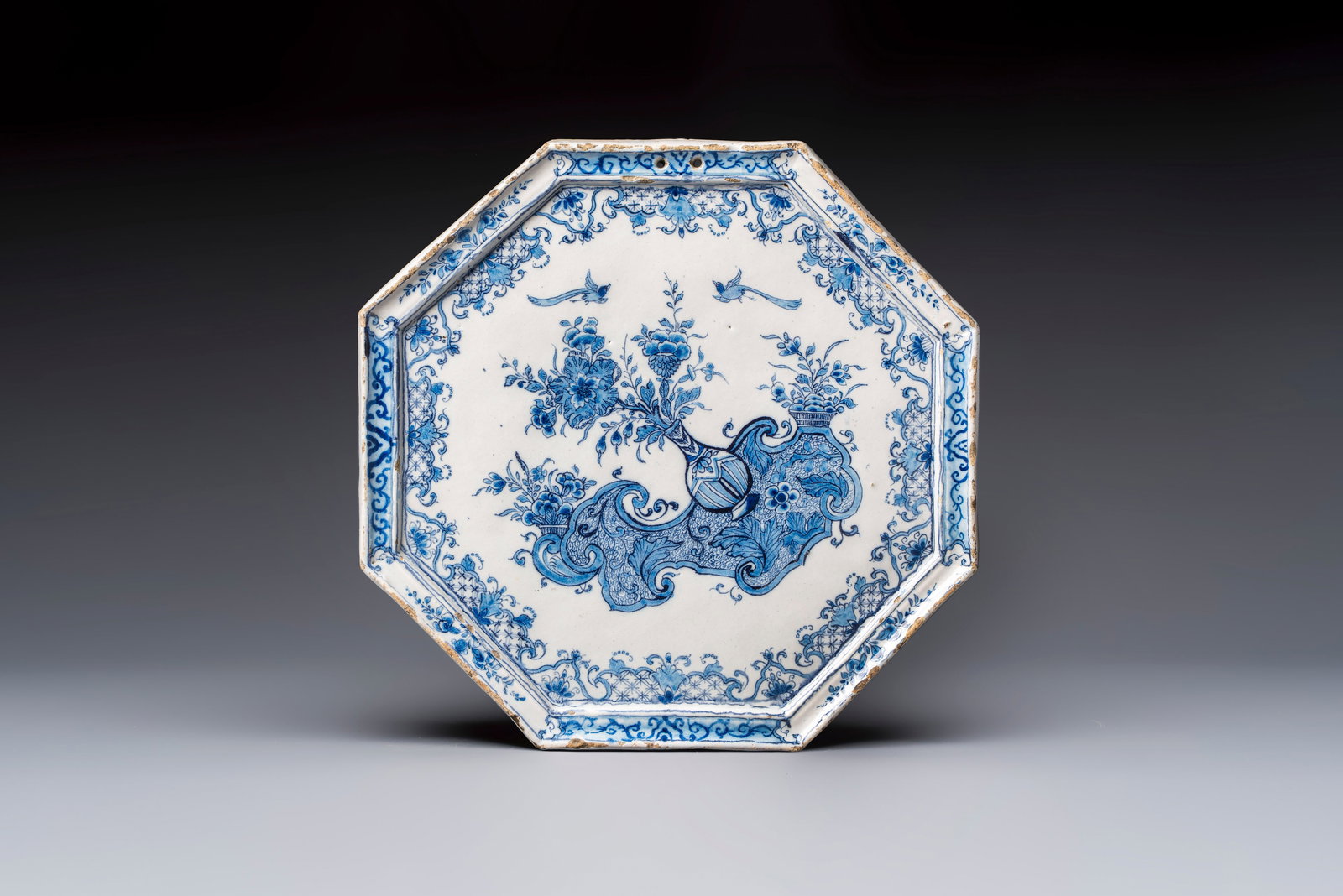 A blue and white Dutch Delft octagonal 'Chinoiserie' plaque, 18th C. (1 of 2)