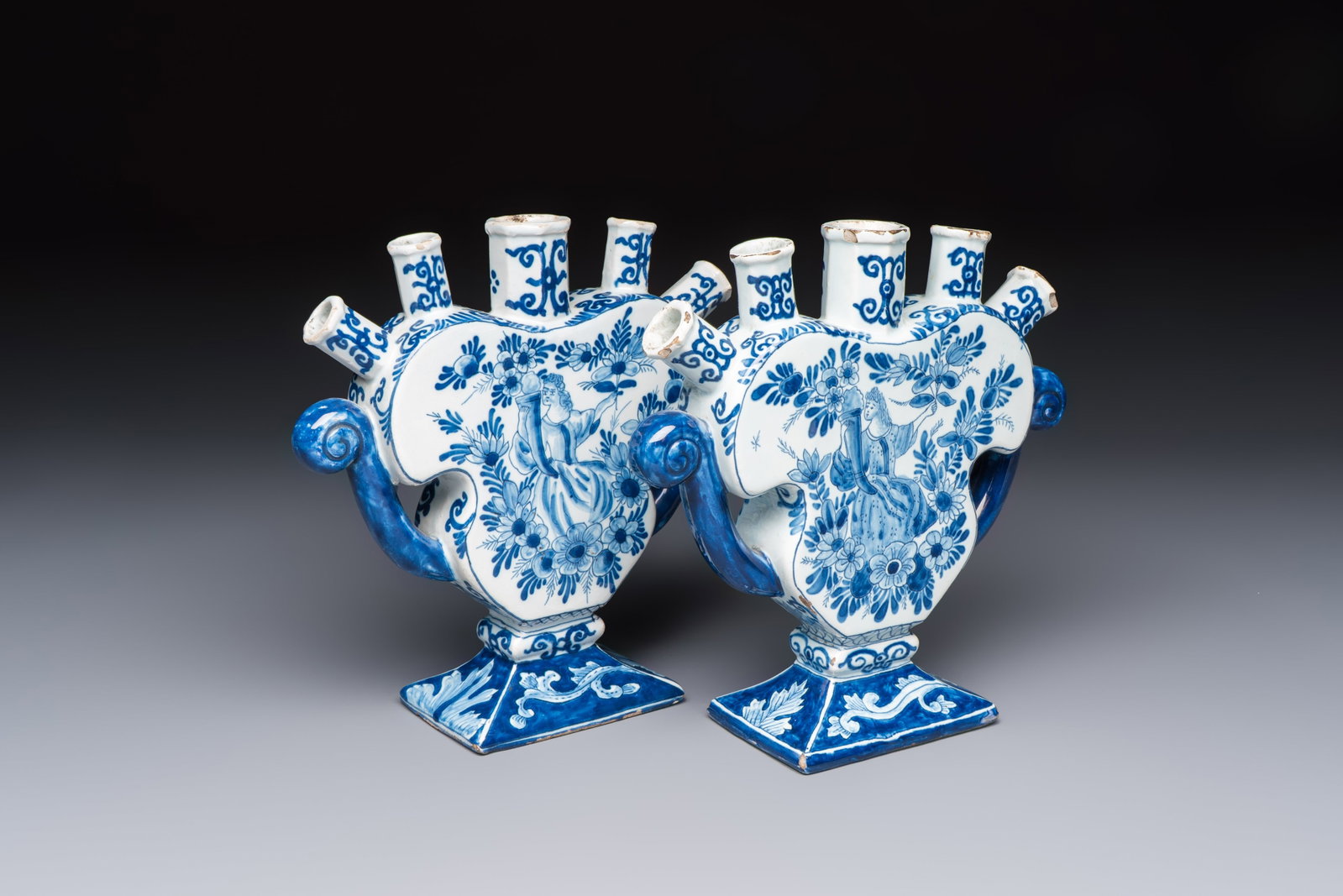 A pair of blue and white Dutch Delft tulip vases with a lady holding a cornucopia, 19th C. (1 of 8)