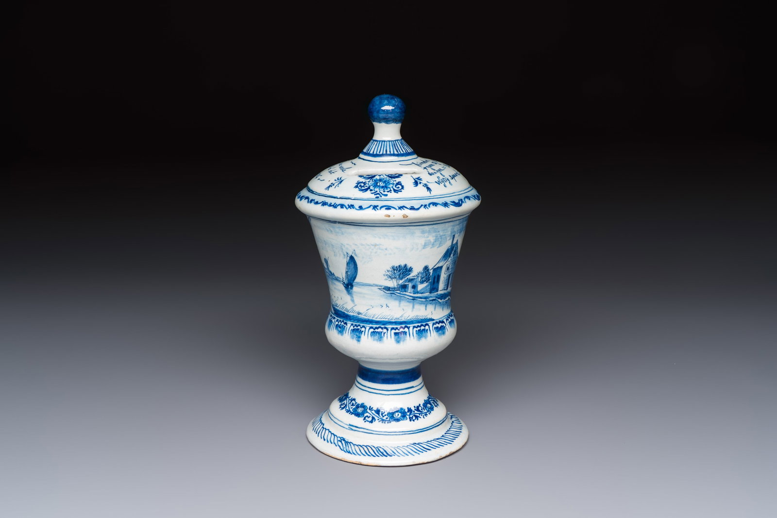 A blue and white inscribed Dutch Delft children's money bank, dated 1786 (1 of 7)