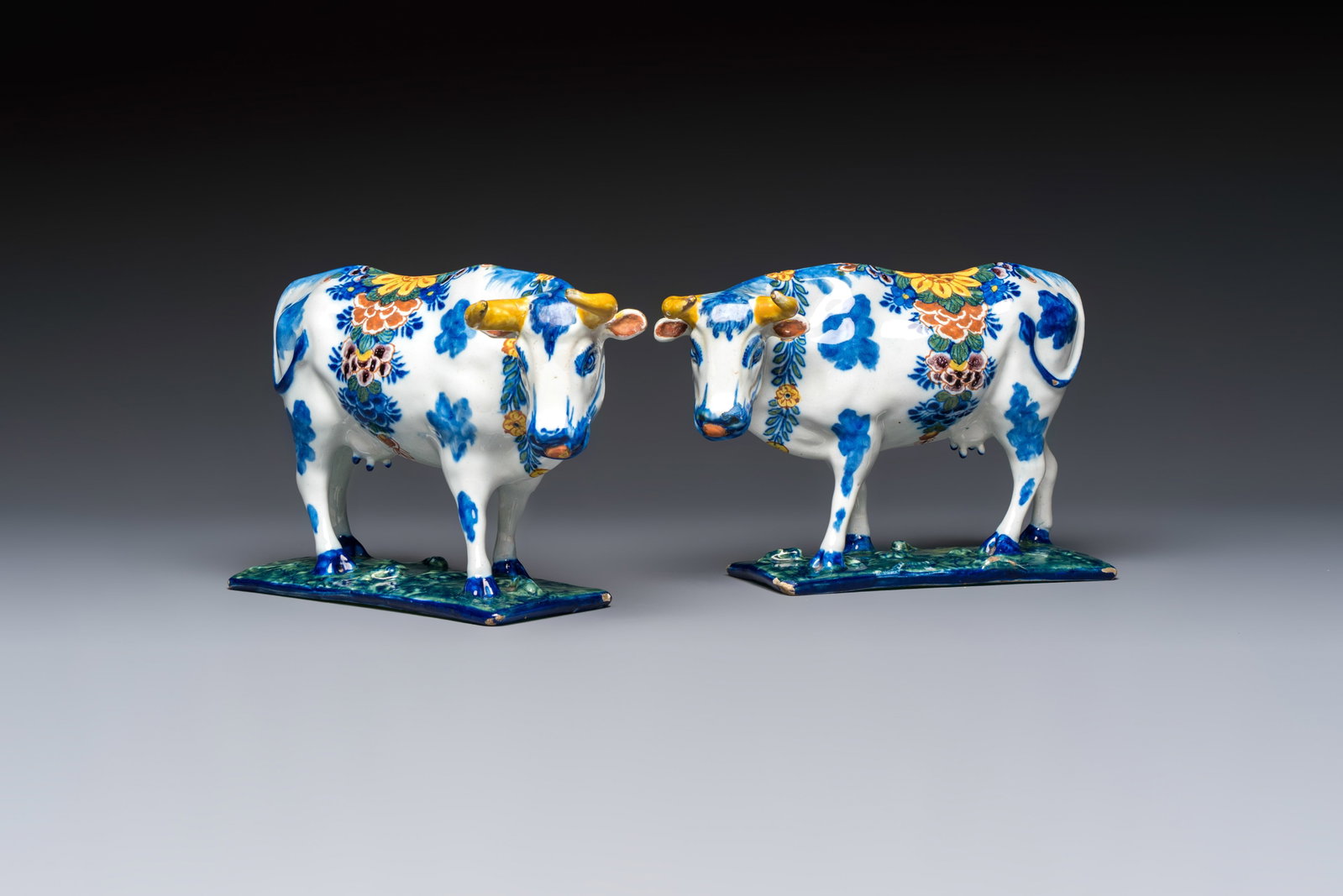 A pair of polychrome Dutch Delft cows, 18th C. (1 of 7)