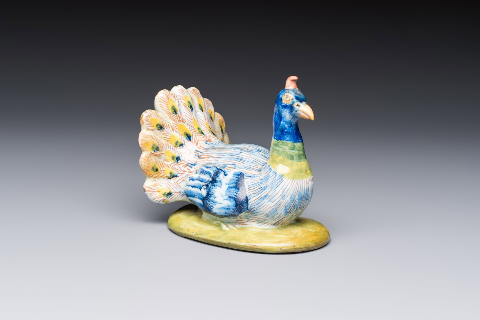 A polychrome Dutch Delft 'Peacock' cover, 18th C. (1 of 8)