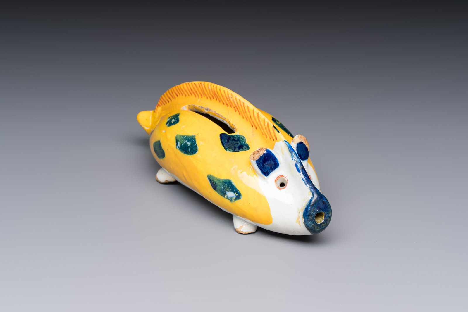 A polychrome Dutch Delft 'Wild Boar' money bank, 18th C. (1 of 7)