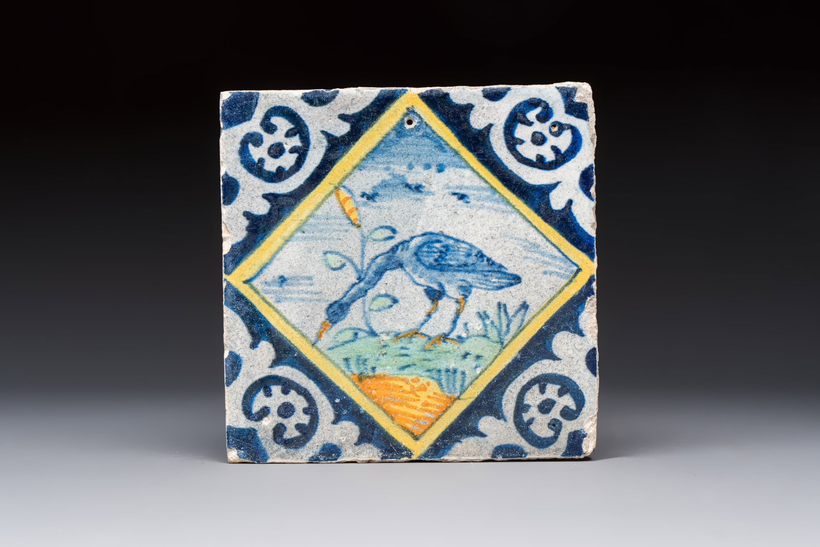 A polychrome Dutch Delft maiolica 'Heron' diamond tile, 16th C. (1 of 2)