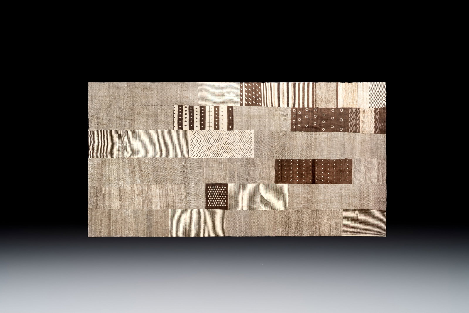 A very large Persian hand-knotted woollen carpet with a geometric patchwork design, 20th C.: A very large Persian hand-knotted woollen carpet with a geometric patchwork design, 20th C. Dim.: 642 x 456 cm Provenance: - A private Belgian collection. - Acquired from NEW TOWN TRADING COMPANY LIMI