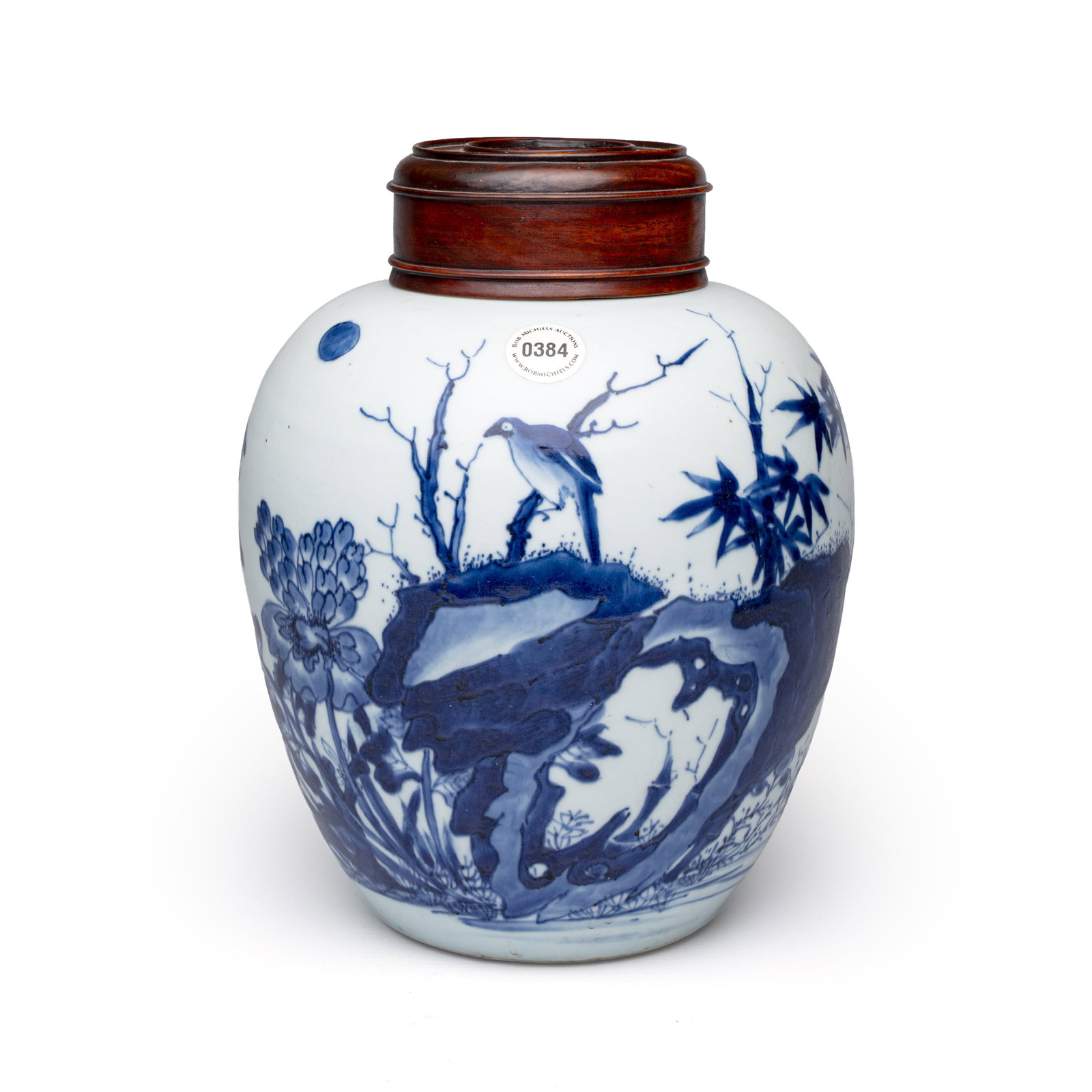 A Chinese blue and white 'Magpies among Peonies' jar with wooden cover, Transitional period: A Chinese blue and white 'Magpies among Peonies' jar with wooden cover, Transitional period H.: 27 cm | Incl. cover H.: 24,6 cm | Excl. Cover Provenance: - Rob Michiels Auctions, Bruges, 21 September 