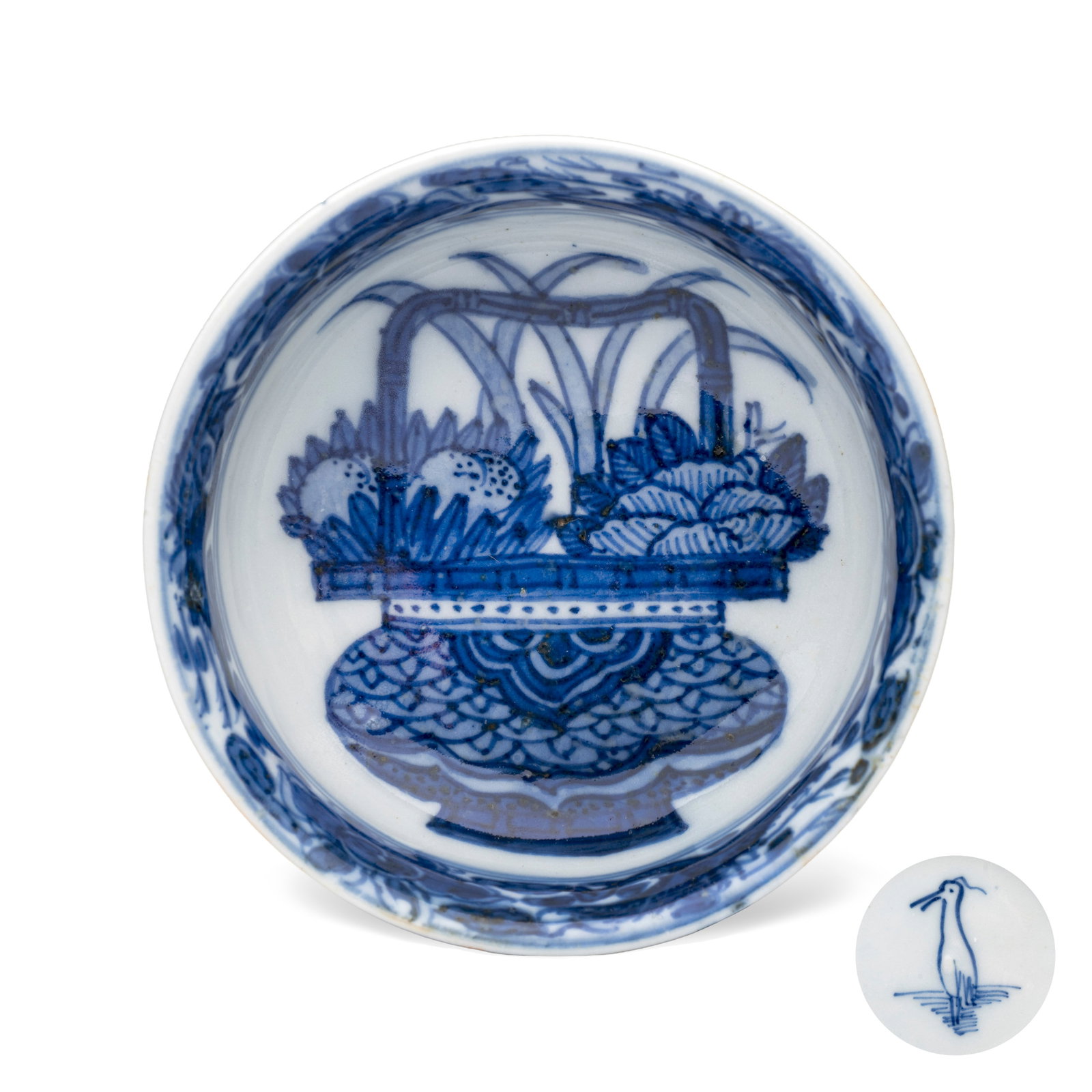 A rare Chinese blue and white 'Flower Basket' shallow bowl, Egret mark, Wanli: A rare Chinese blue and white 'Flower Basket' shallow bowl, Egret mark, Wanli Dia.: 8,4 cm - H.: 2,9 cm Provenance: - The Demets Collection, Aalst, no. 53. - March Michot, Bruges. - The Mr. and Mrs. B