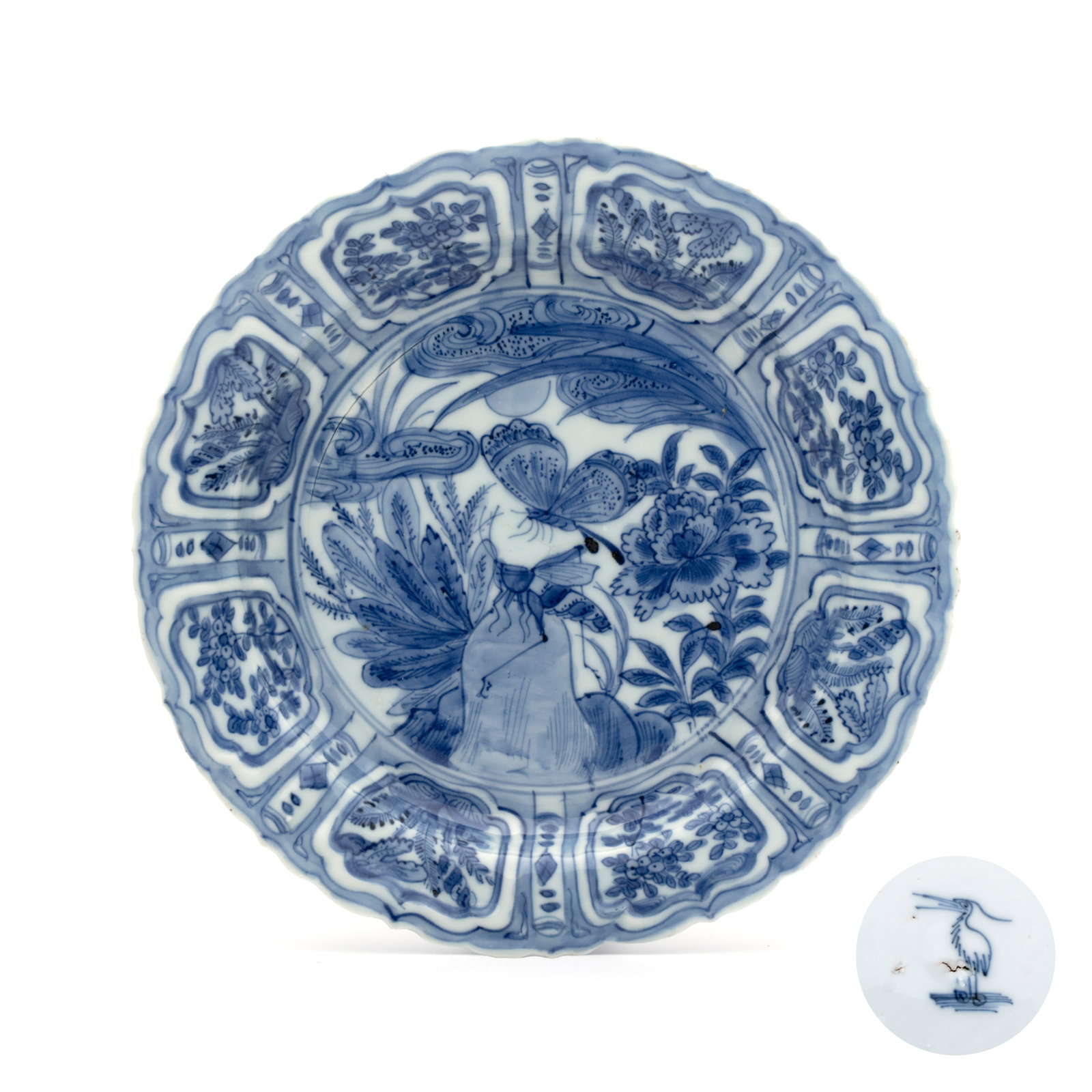 A Chinese blue and white 'Grasshopper and Butterfly' plate, Egret mark, Wanli (1 of 2)