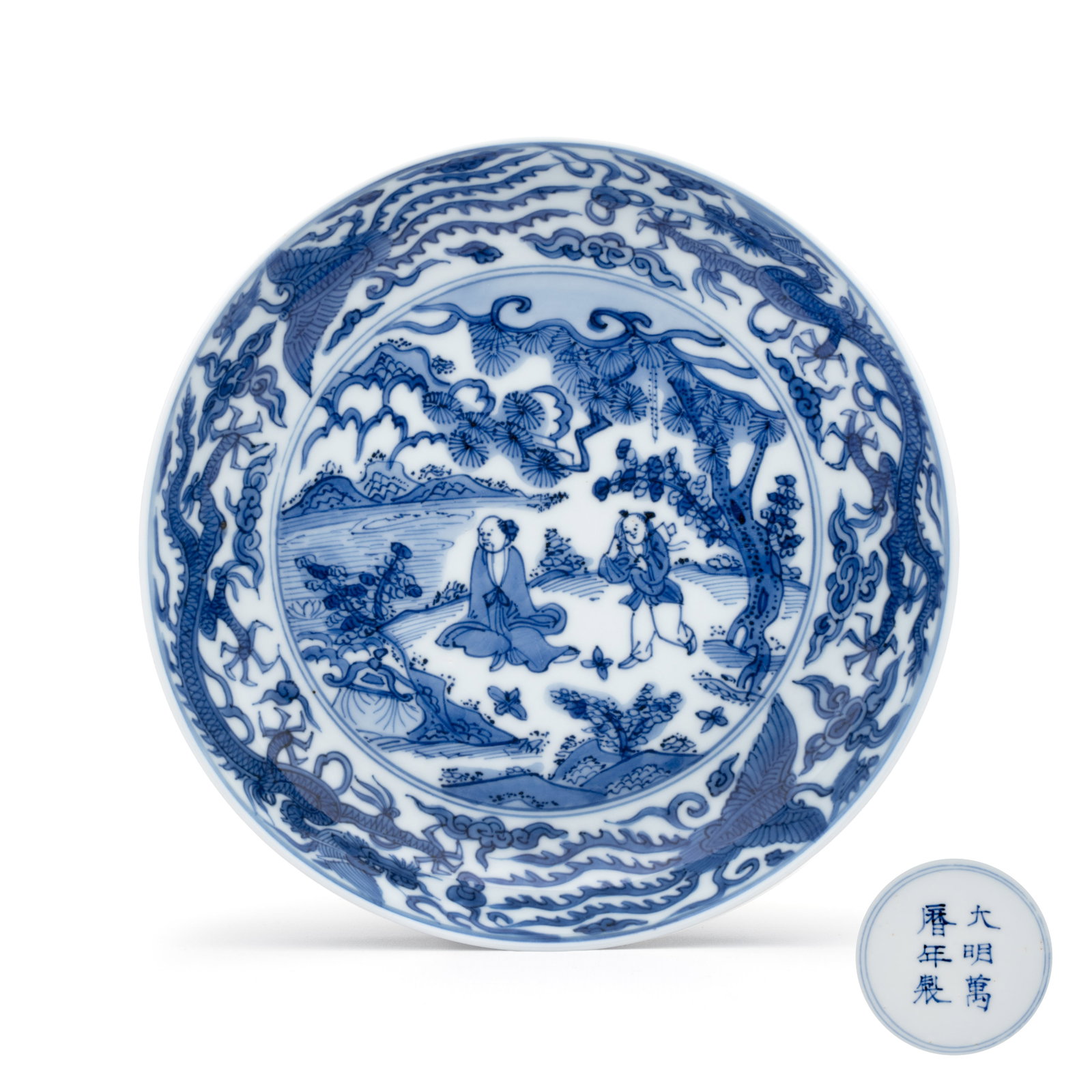 A Chinese blue and white 'Sage and Servant' plate, Wanli mark and of the period (1 of 4)