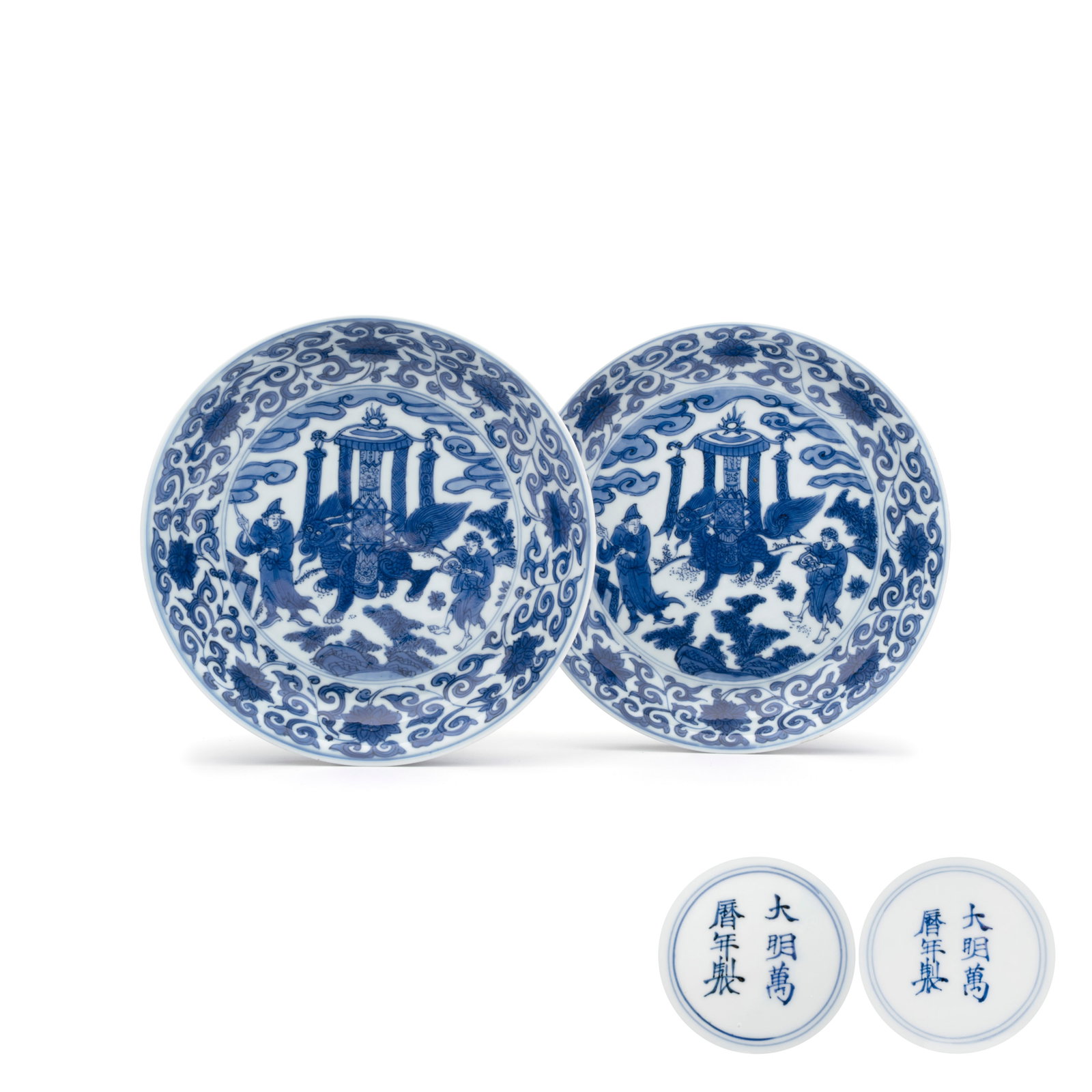 An extremely rare pair of Chinese blue and white 'Foreigners Presenting Treasures' plates, Wanli: An extremely rare pair of Chinese blue and white 'Foreigners Presenting Treasures' plates, Wanli mark and of the period Dia.: 20,6 cm Provenance: The example with the R.O. and Bluett and Sons sticker: