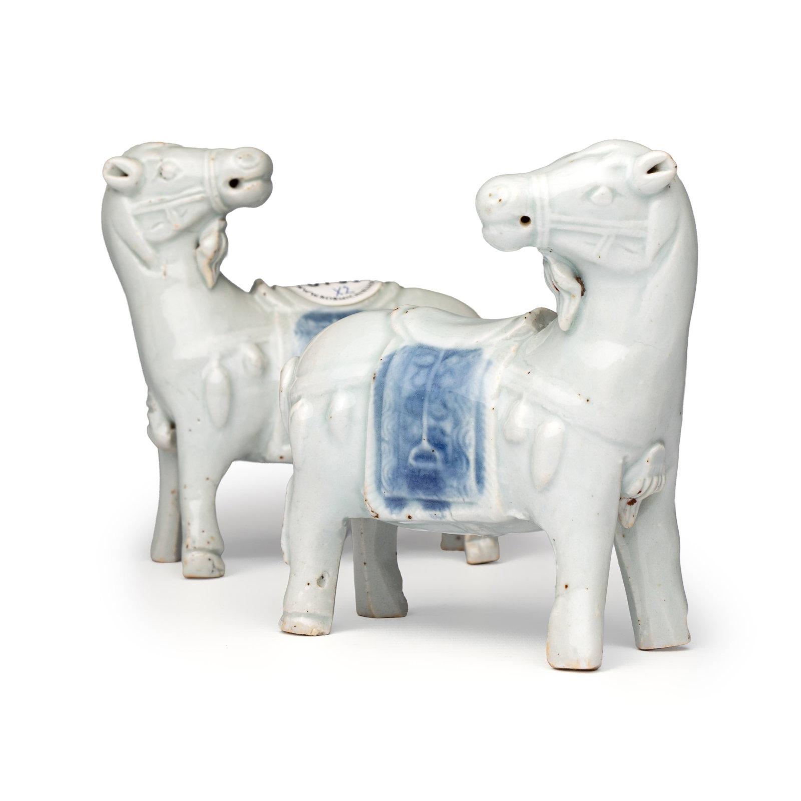 A pair of Chinese blue and white models of horses, Qianlong: A pair of Chinese blue and white models of horses, Qianlong Dim: 4 x 8,5 x 10,5 cm Provenance: - The collection of a Belgian industrialist family, formed between ca. 1960 and 1980. - Rob Michiels Auct