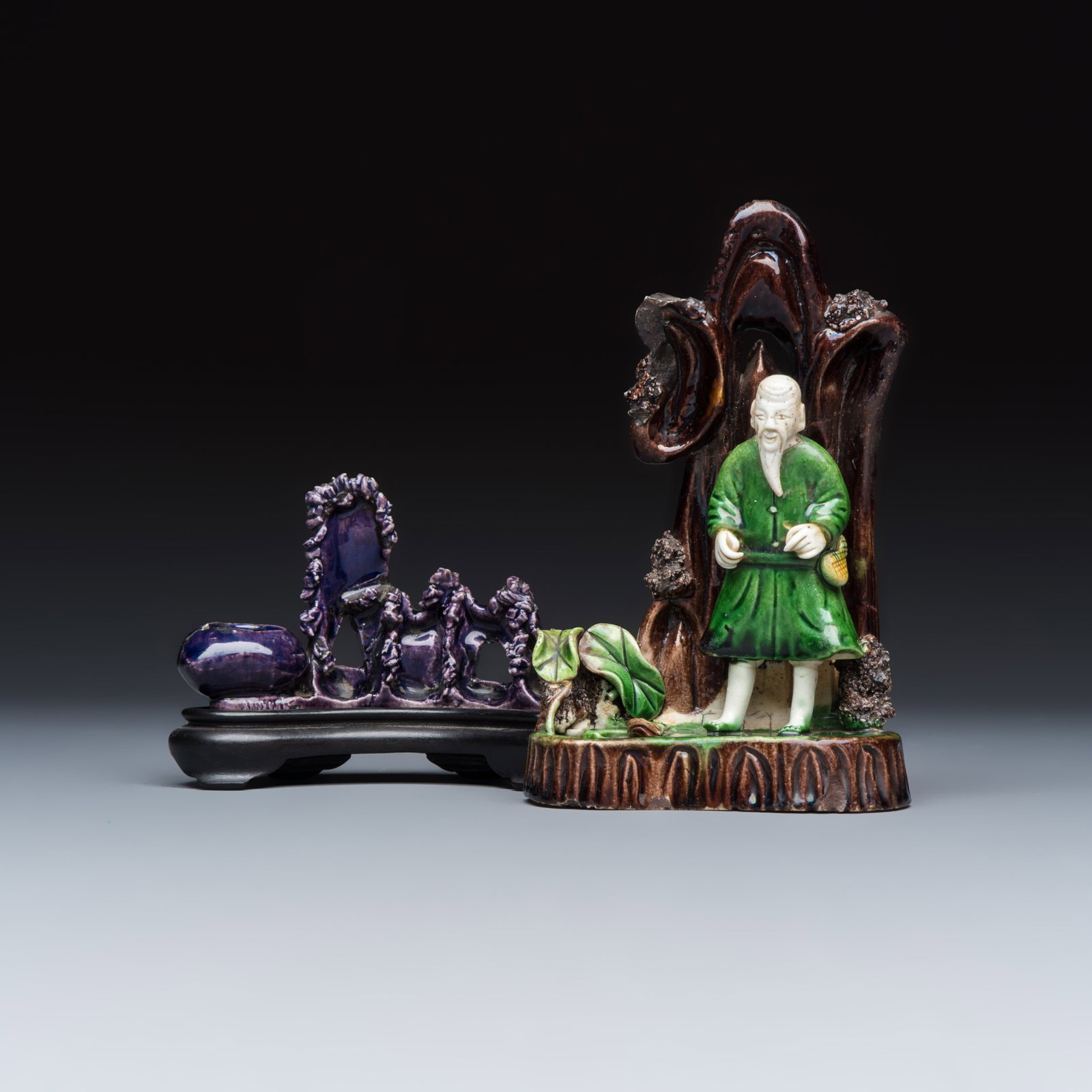 A Chinese aubergine-glazed brush rest and a famille verte sancai biscuit group, Kangxi (1 of 10)