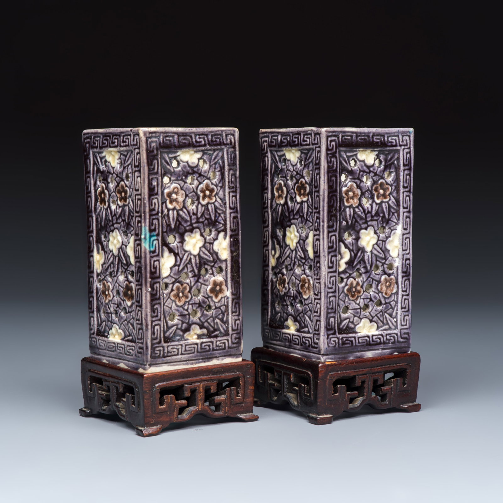 A pair of Chinese aubergine-glazed openworked square brush pots on later wooden stands, Kangxi (1 of 10)