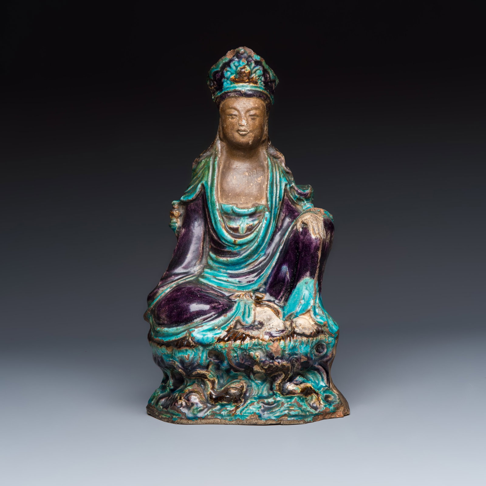 A Chinese Fahua-glazed stoneware model of Guanyin, Ming (1 of 7)
