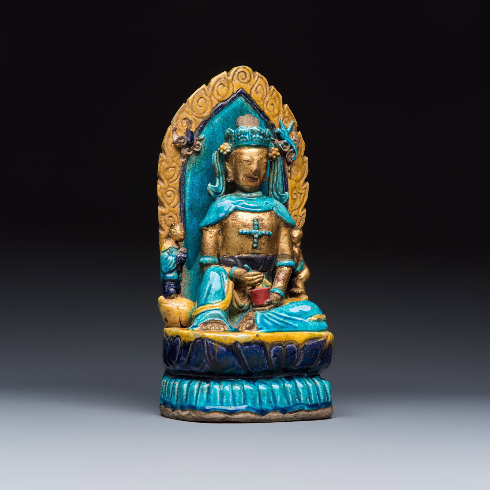A Chinese gilt-decorated Fahua-glazed stoneware 'Bodhisattva with Attendants' group, Ming (1 of 7)