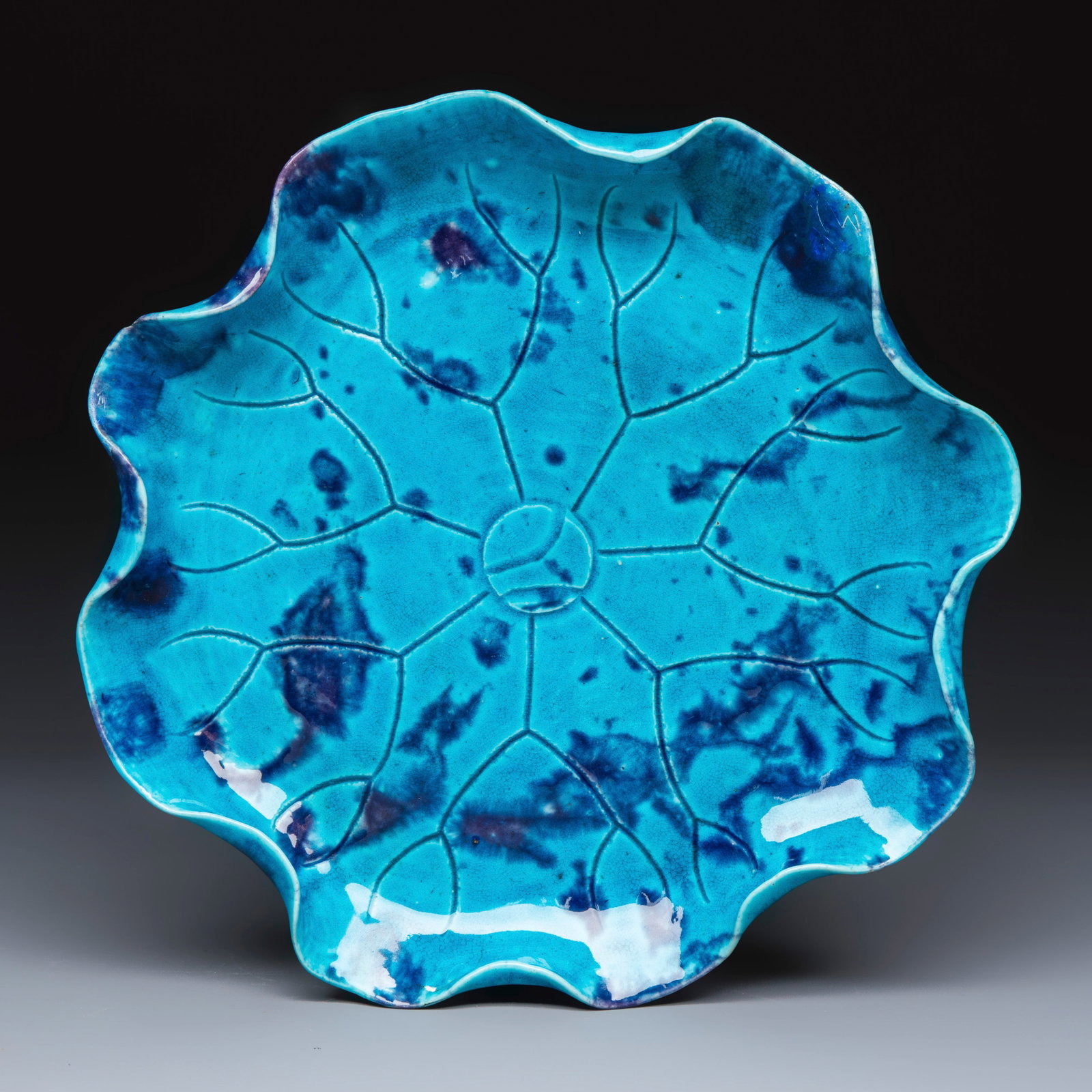 A Chinese turquoise-glazed purple-splashed 'Lotus Leaf' dish, Kangxi: A Chinese turquoise-glazed purple-splashed 'Lotus Leaf' dish, Kangxi Dia.: 27 cm