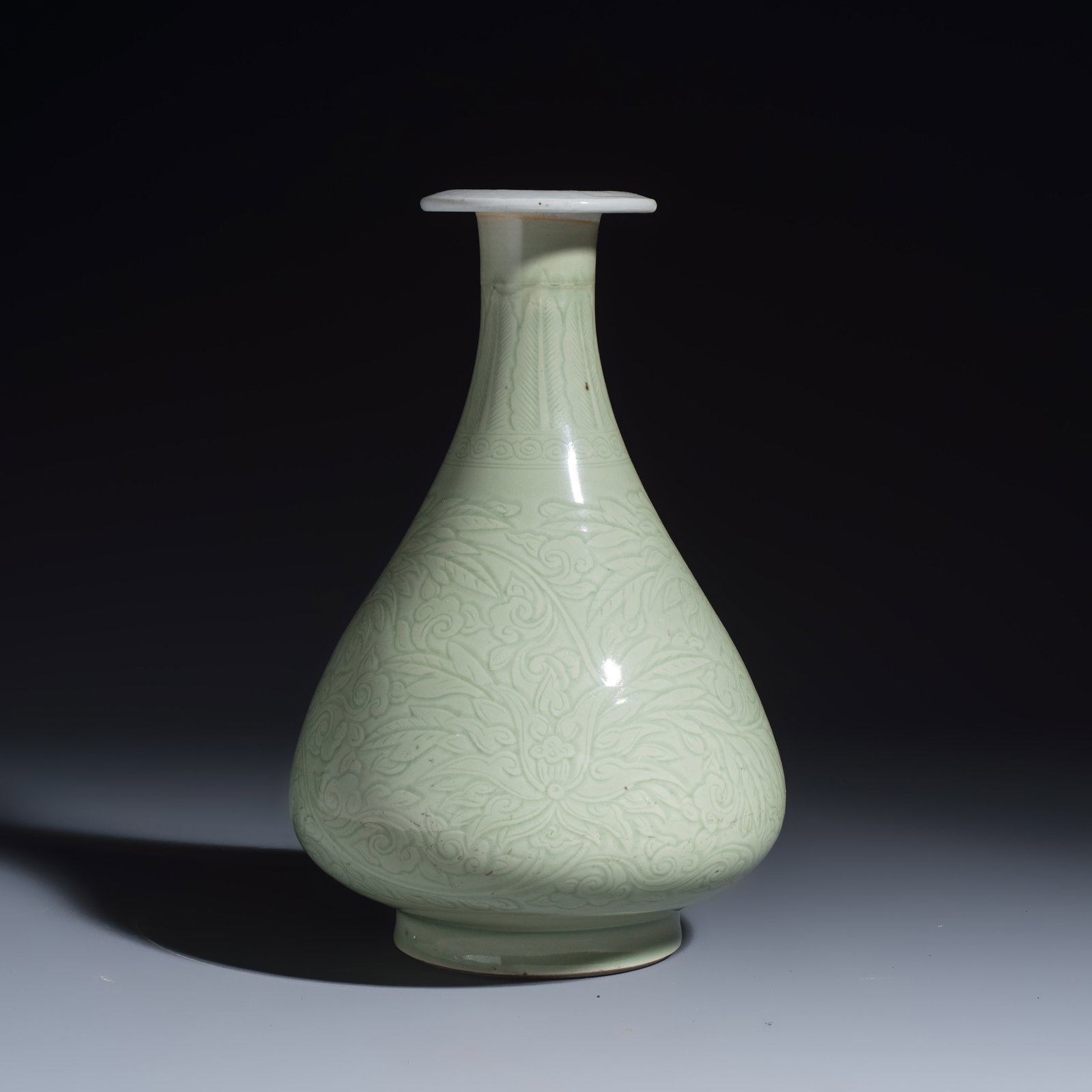 A Chinese celadon-glazed incised 'Yuhuchunping' vase with lotus scroll design, Kangxi (1 of 7)