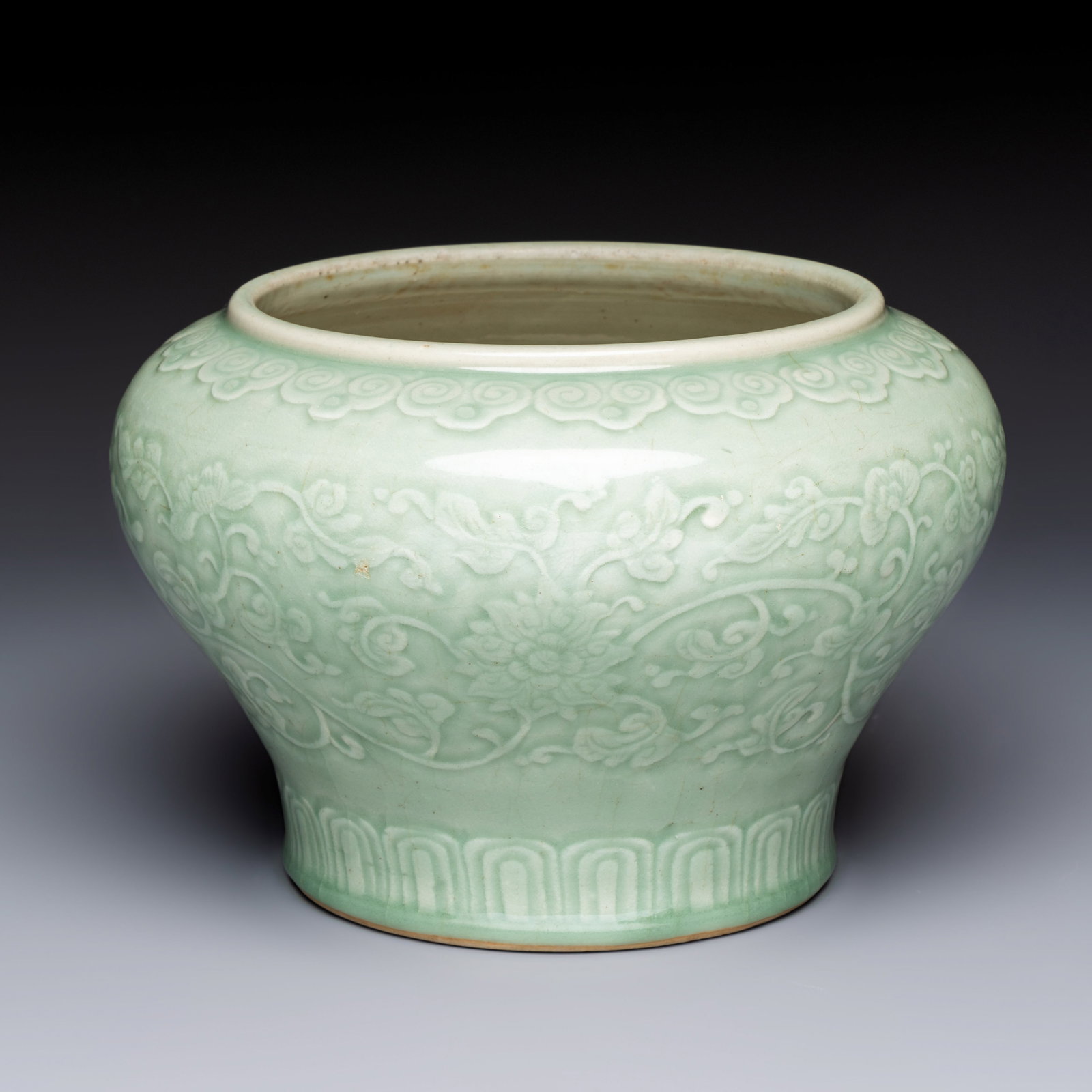 A Chinese celadon-glazed 'Flower Scroll' jar, Qianlong (1 of 7)