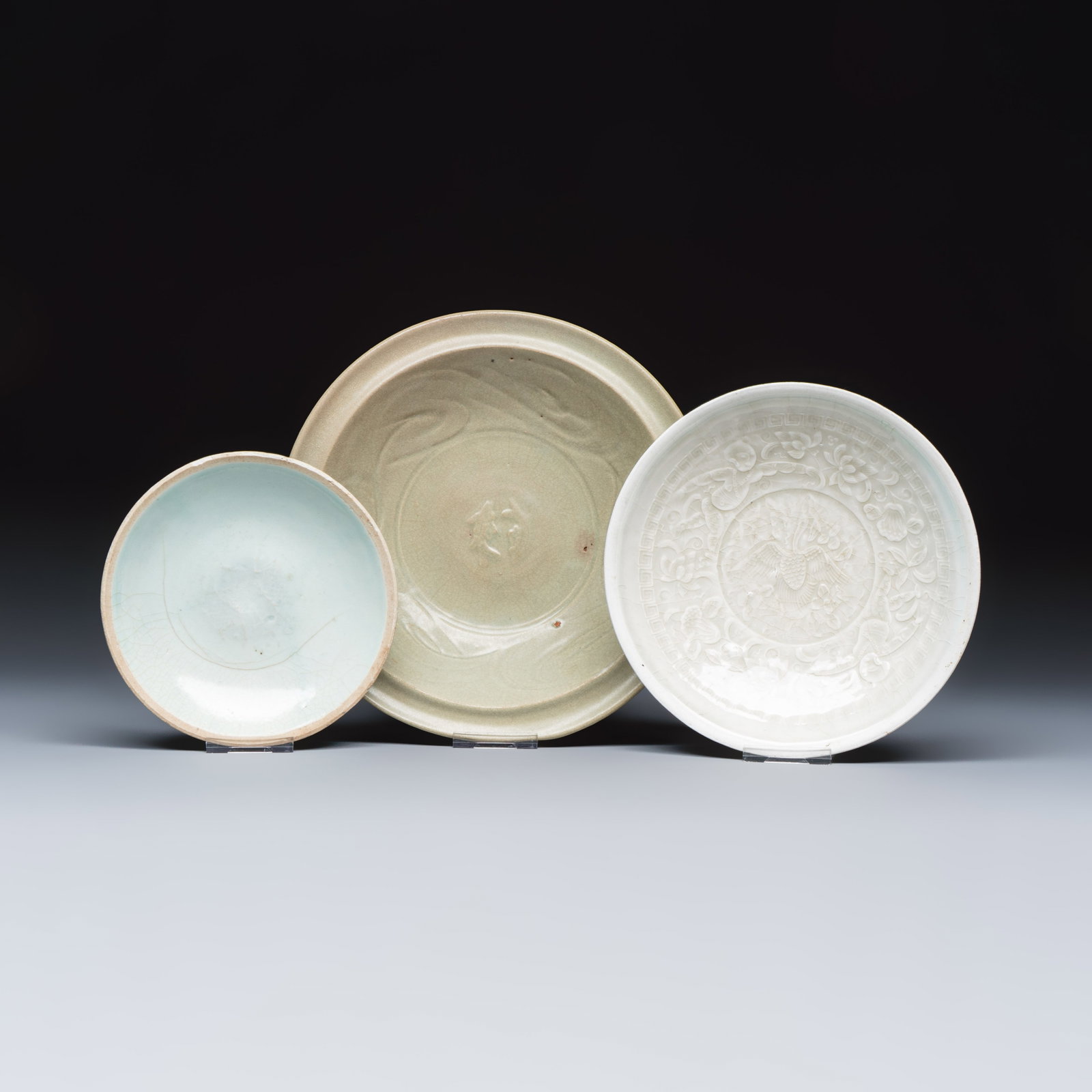 Two Chinese qingbai plates and a Longquan celadon plate, Song and later: Two Chinese qingbai plates and a Longquan celadon plate, Song and later Dia.: 21,5 cm | the largest Dia.: 14 cm | the smallest