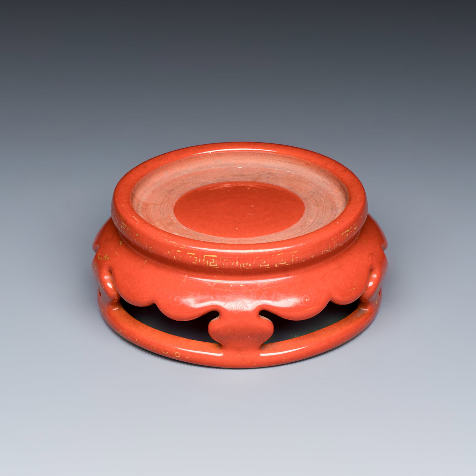 A Chinese gilt-decorated coral-red-glazed stand, Qianlong mark and possibly of the period (1 of 7)
