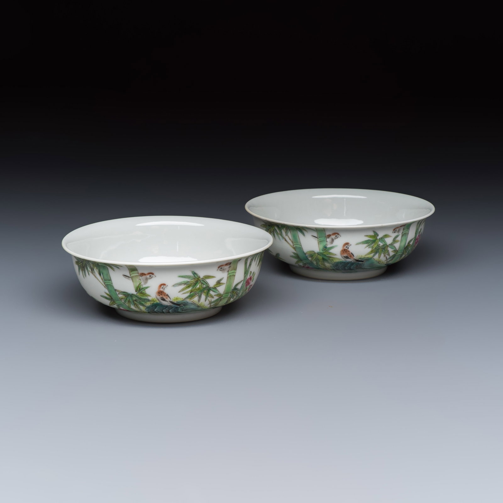 A pair of Chinese famille rose shallow bowls with birds among bamboo, and bats, Yongzheng mark, (1 of 7)