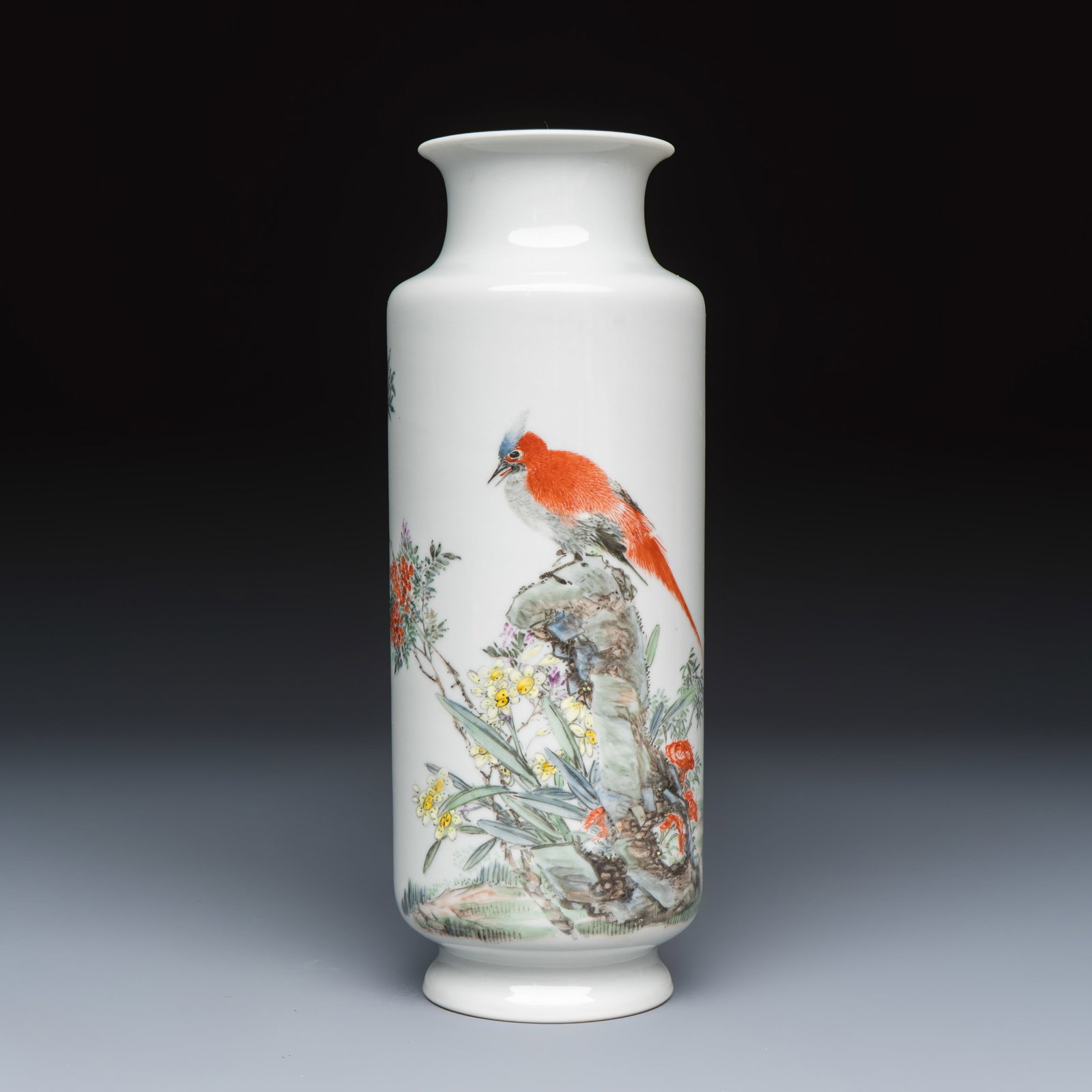 A Chinese famille rose 'Bird Among Flowers and Rockwork' rouleau vase, signed Liu Yucen, Jiu Jiang: A Chinese famille rose 'Bird Among Flowers and Rockwork' rouleau vase, signed Liu Yucen, Jiu Jiang You Xin Ci Zhuang Zhen Pin mark, dated 1946 H.: 24,2 cm