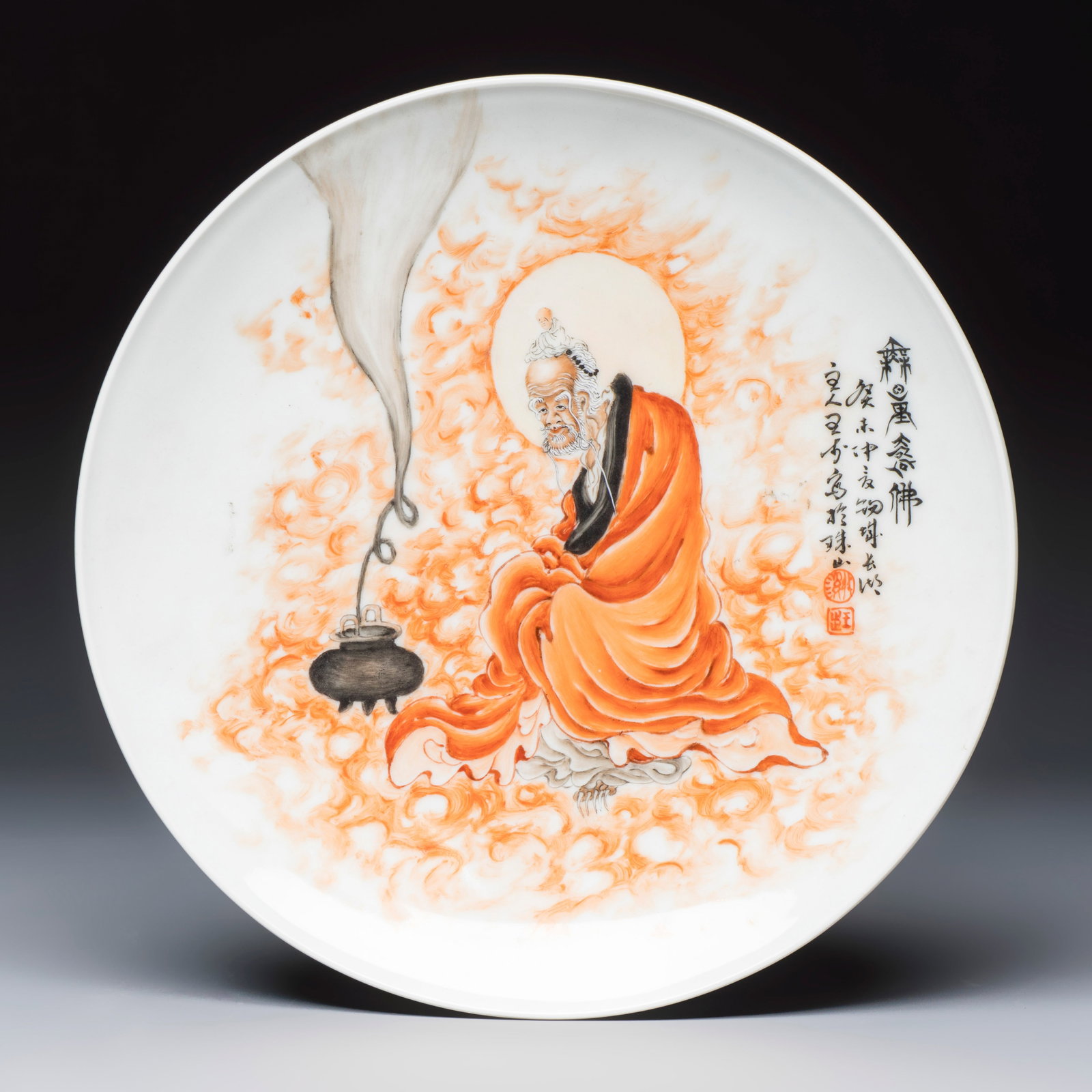 A Chinese iron-red and grisaille-decorated dish, in the style of Wang Bu, 20th C. (1 of 2)