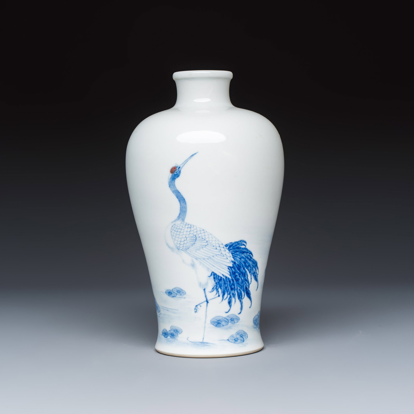 A Chinese blue, white and copper-red 'Crane' vase, Jing De Zhen Zhi mark, 20th C. (1 of 6)