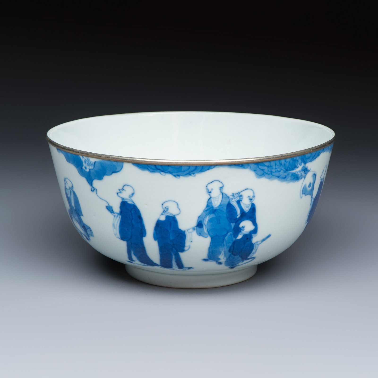 A Chinese blue and white 'Bleu de Hue' bowl with eighteen luohan, N?i ph? mark, 19th C. (1 of 7)