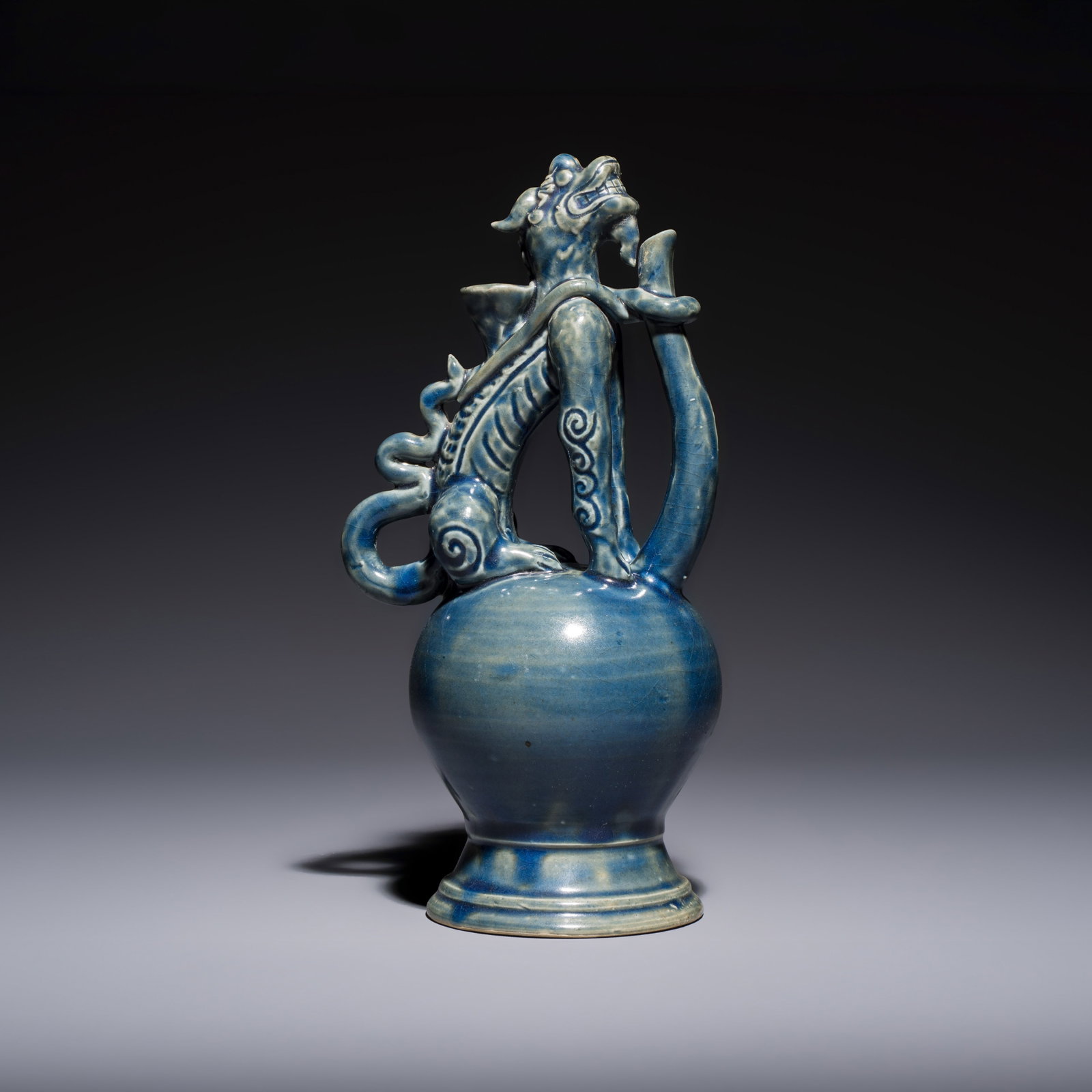 A Vietnamese or Annamese blue-glazed 'Qilin' ewer, probably M?c dynasty, 16th C. (1 of 7)