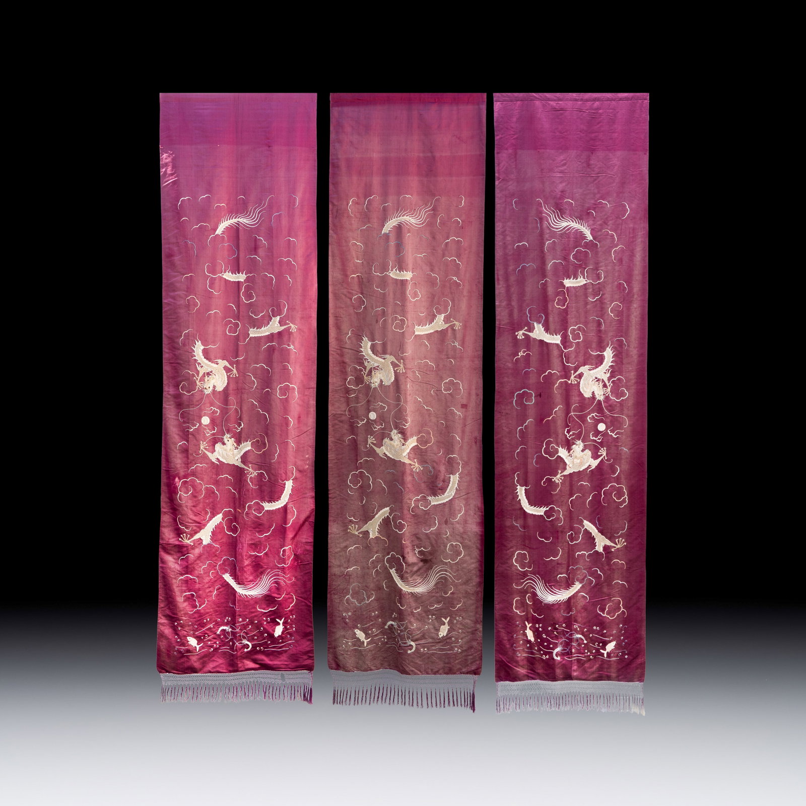 Three large Vietnamese purple-ground embroidered silk 'Dragons among Clouds' panels, 19th C. (1 of 2)