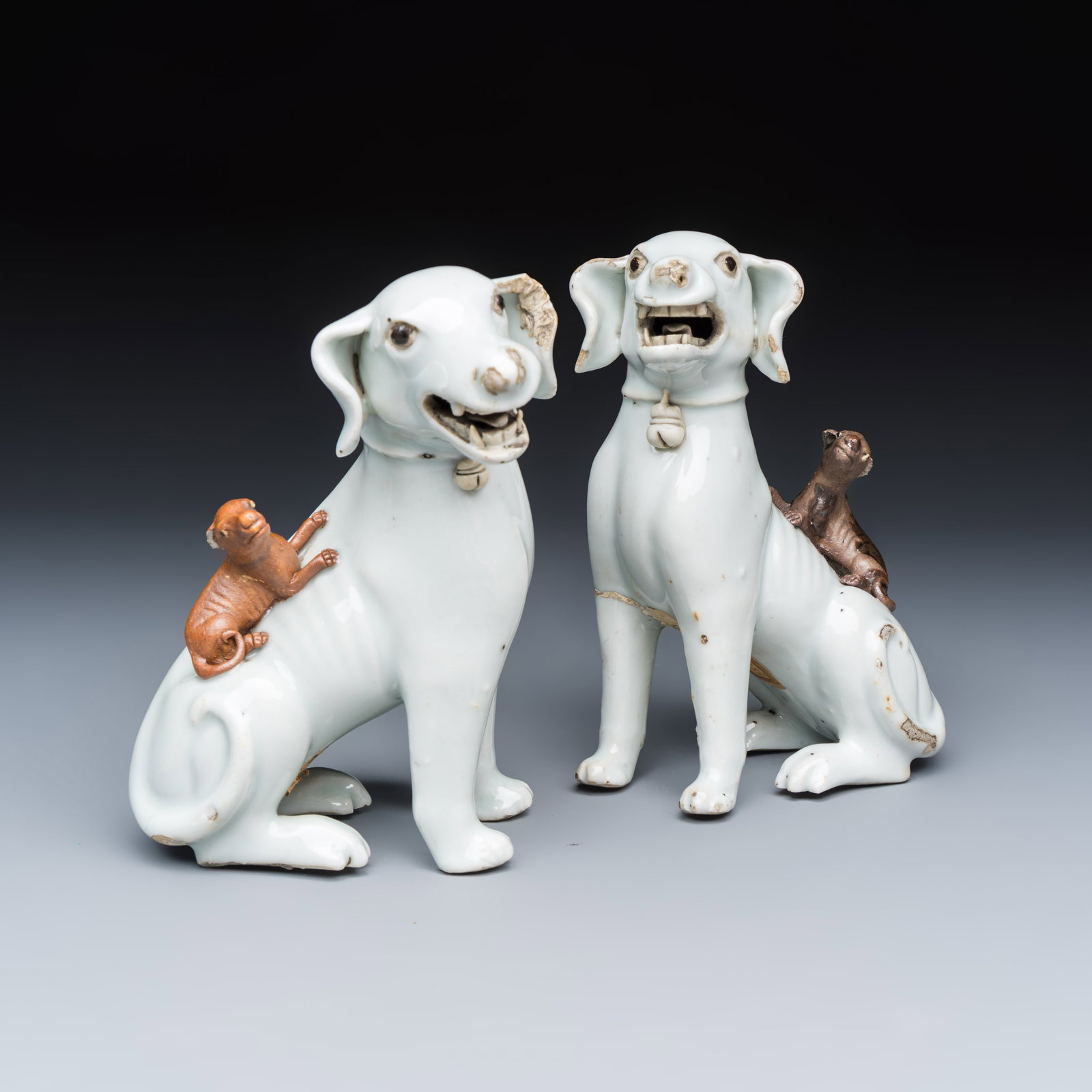 A pair of Chinese export white-glazed and biscuit models of hounds with pups, Kangxi (1 of 7)