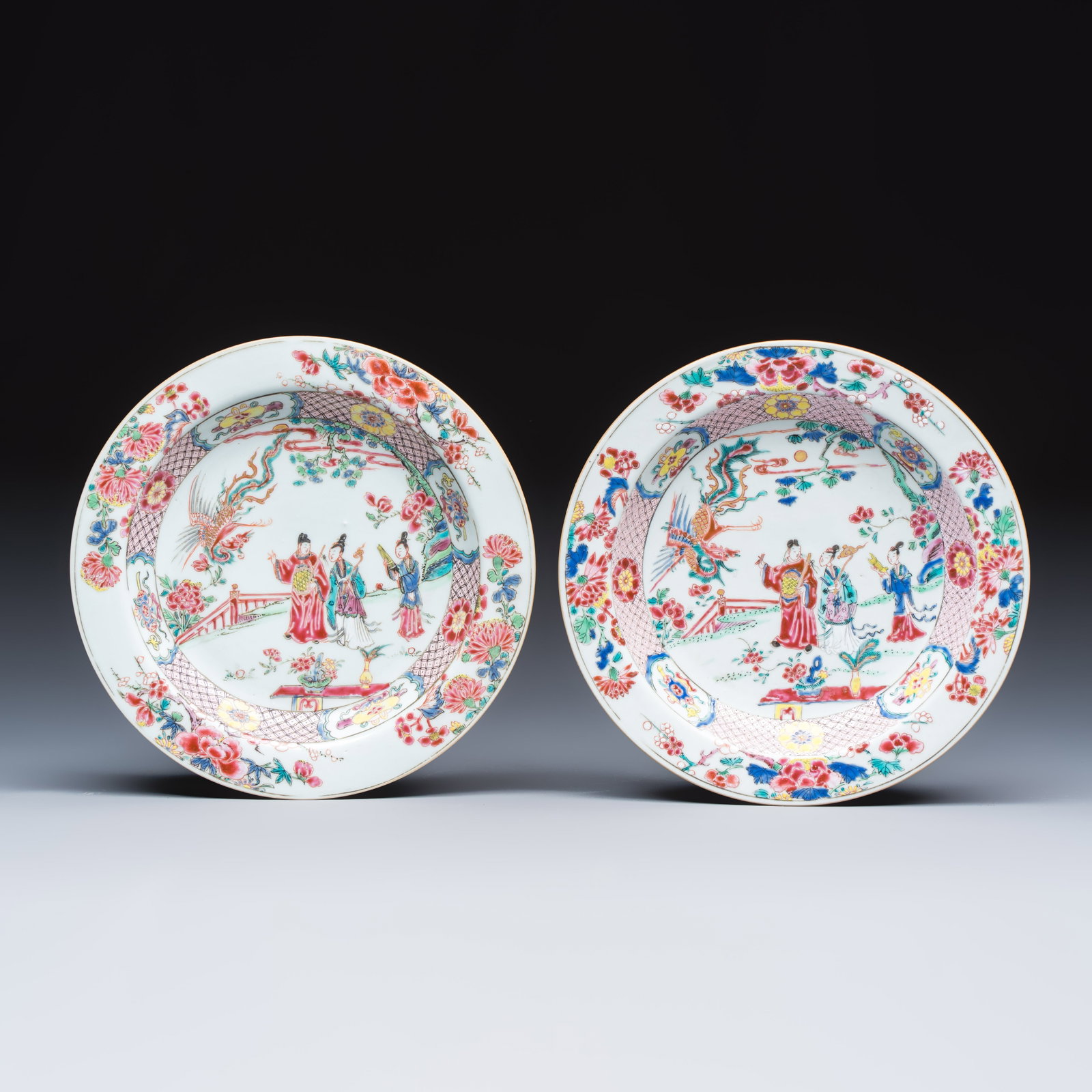 A pair of Chinese famille rose 'Chui Xiao Yin Feng' plates, Yongzheng (1 of 2)
