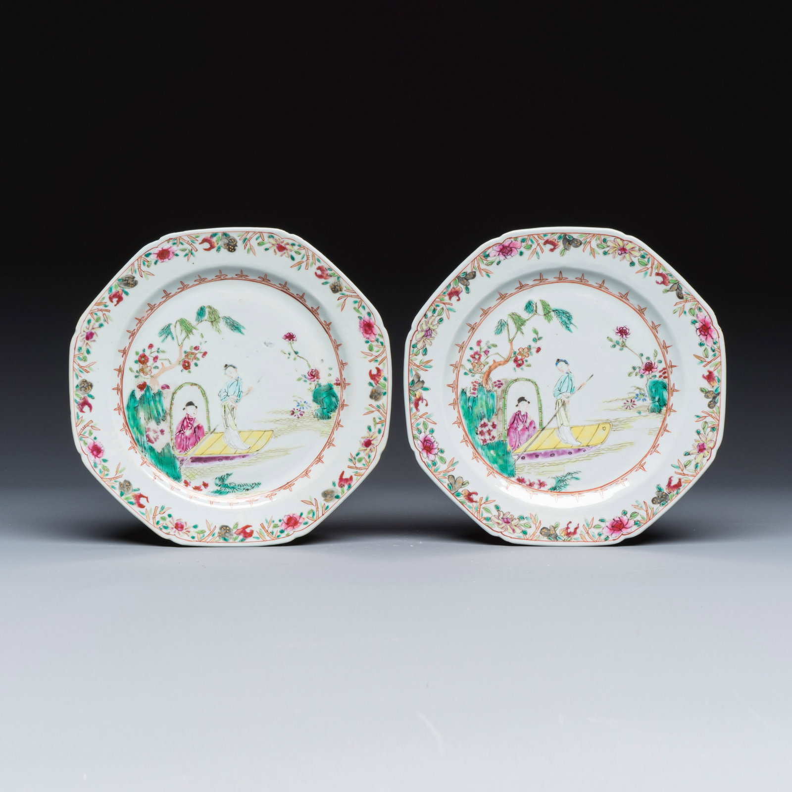 A pair of octagonal Chinese famille rose plates with a boat on a river, Qianlong: A pair of octagonal Chinese famille rose plates with a boat on a river, Qianlong Dia.: 22,4 cm