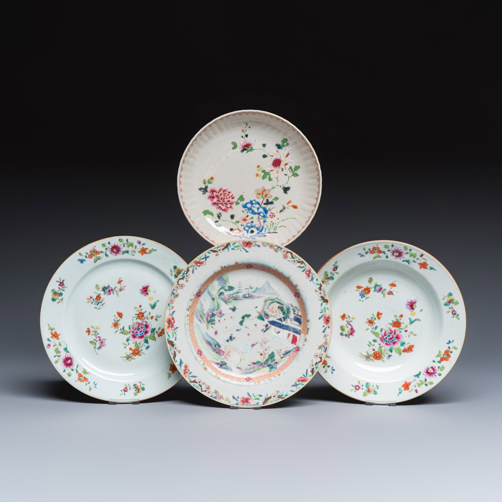 Four Chinese famille rose plates with floral and landscape design, Qianlong: Four Chinese famille rose plates with floral and landscape design, Qianlong Dia.: 22,9 cm | the largest Dia.: 20,9 cm | the smallest