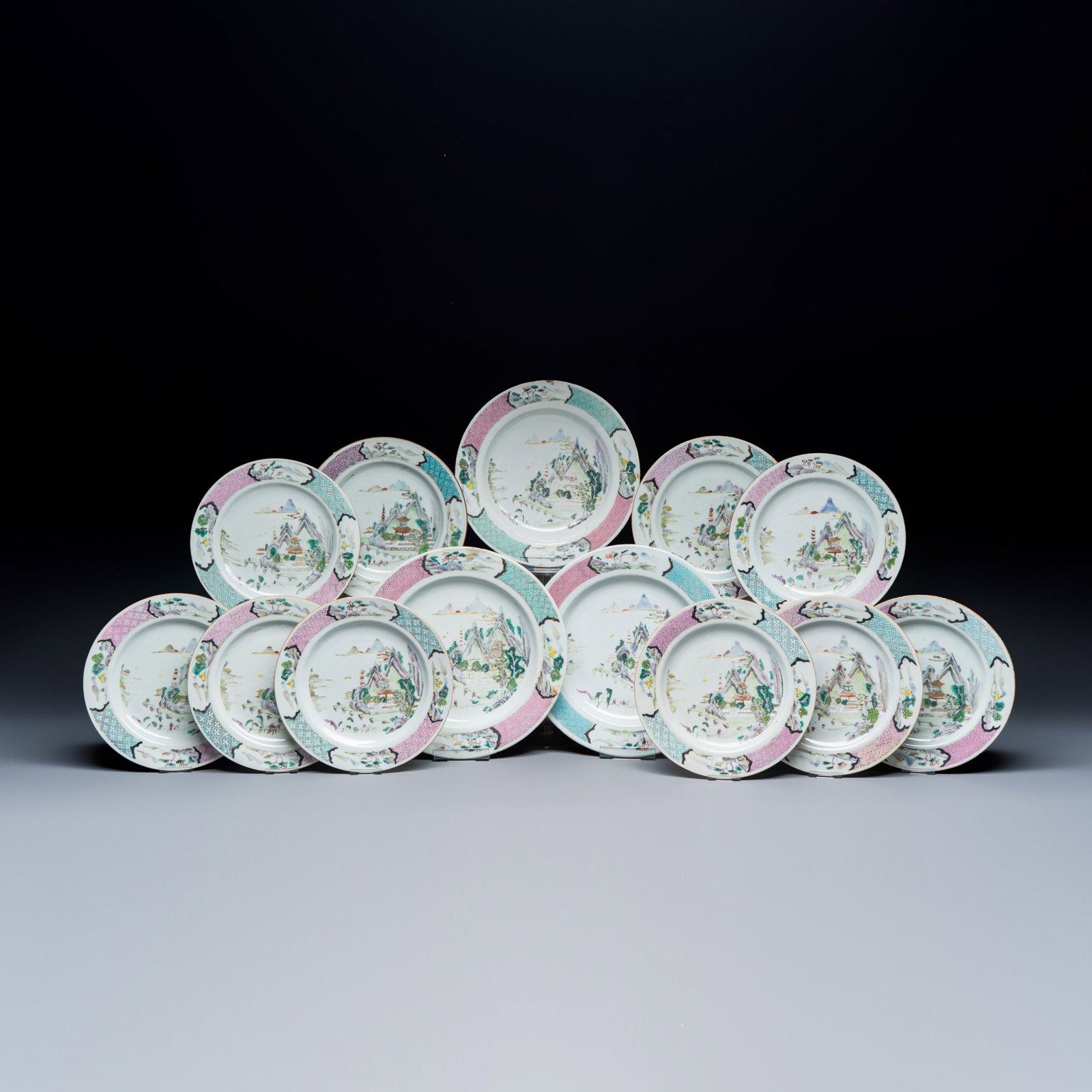 A collection of 13 Chinese famille rose 'Landscape' plates and dishes, Yongzheng: A collection of 13 Chinese famille rose 'Landscape' plates and dishes, Yongzheng Dia.: 29 cm | the largest Dia.: 23,3 cm | the smallest