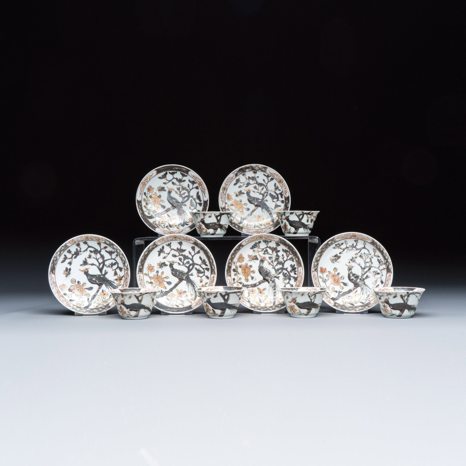 A set of six Chinese silver and gilt-decorated 'Pheasants Among Flowering Branches' tea bowls and: A set of six Chinese silver and gilt-decorated 'Pheasants Among Flowering Branches' tea bowls and saucers, Qianlong Dia.: 10,6 cm | the saucers Dia.: 6,6 cm - H.: 3,5 cm | the tea bowls