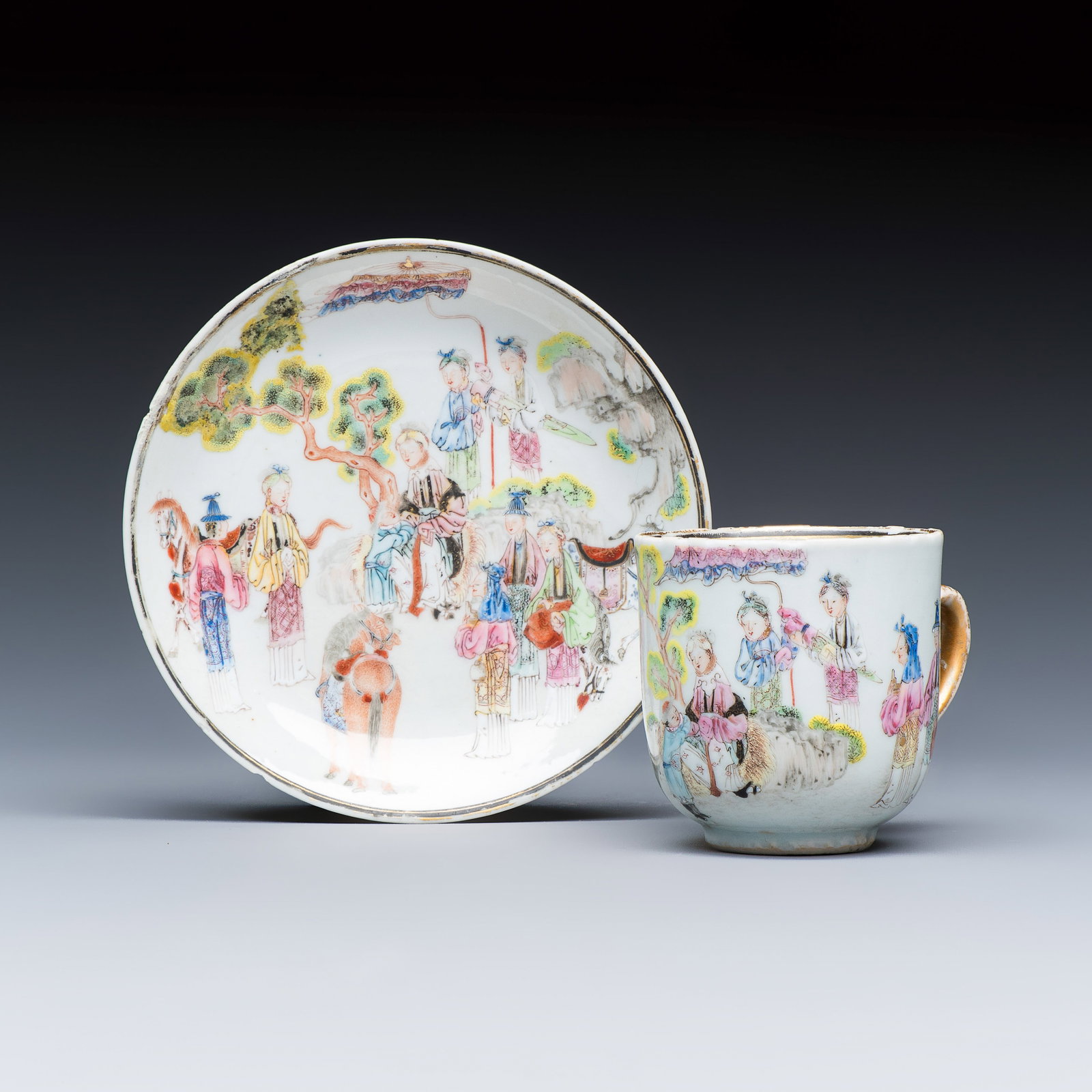 A fine Chinese famille rose cup and saucer with narrative design, Yongzheng/Qianlong: A fine Chinese famille rose cup and saucer with narrative design, Yongzheng/Qianlong Dia.: 12 cm | the saucer L.: 8,1 cm - H.: 6,1 cm | the cup