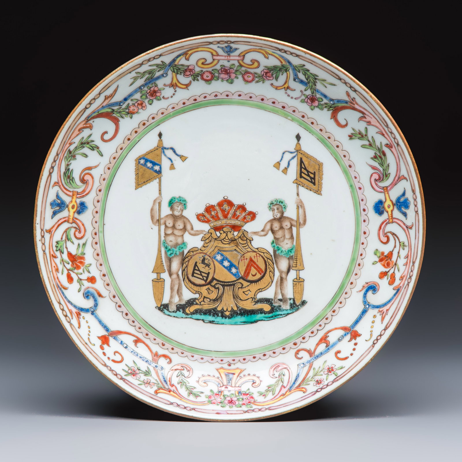 A Chinese famille rose armorial dish with the arms of Goos de Ghyseghem, Vecquemans and Golbeau for: A Chinese famille rose armorial dish with the arms of Goos de Ghyseghem, Vecquemans and Golbeau for the Belgian market, Yongzheng/Qianlong Dia.: 24,1 cm