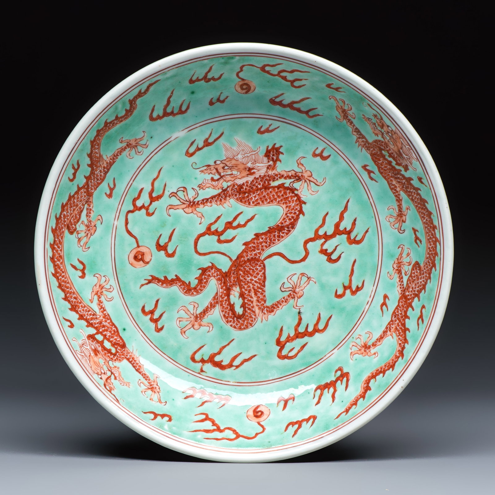 A Chinese iron-red-decorated and green-enamelled 'Dragon' plate, Kangxi mark and of the period: A Chinese iron-red-decorated and green-enamelled 'Dragon' plate, Kangxi mark and of the period Dia.: 22 cm Ref.: Sotheby's New York, 15 March 2017, lot 692, for a comparable example. (sold USD 18.750)