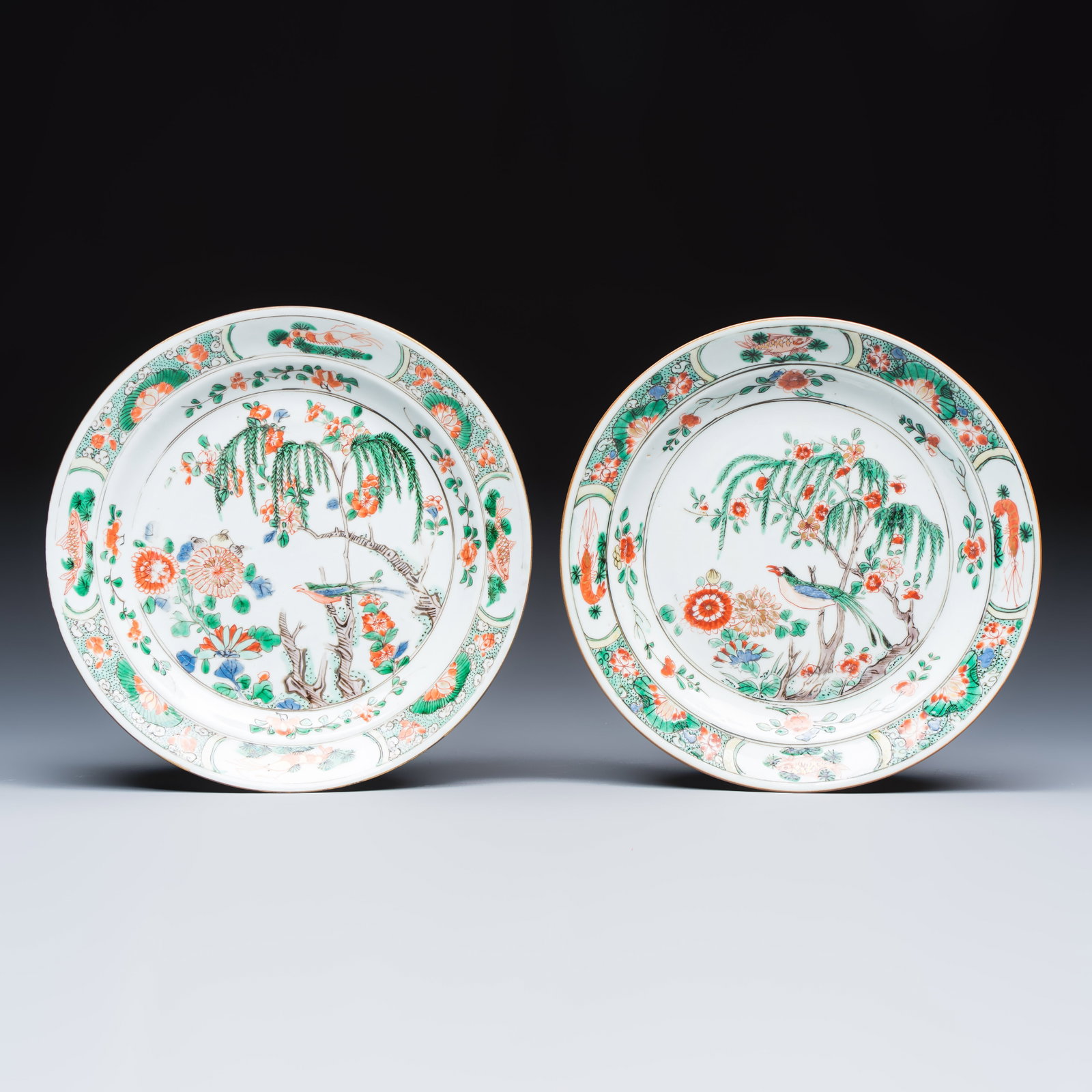 A pair of Chinese famille verte 'Bird among Willow and Flowering Branches' plates, Kangxi (1 of 2)