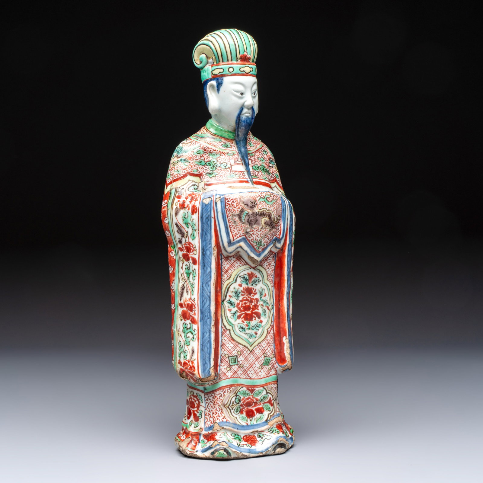 A rare Chinese wucai figure of a dignitary, late Ming/Transitional period (1 of 7)
