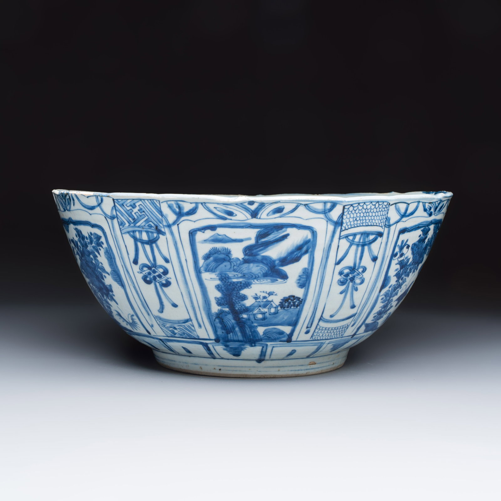 A large Chinese 'Kraak' blue and white 'Mountainous Landscape' bowl, Fu Gui Jia Qi mark, Wanli (1 of 6)