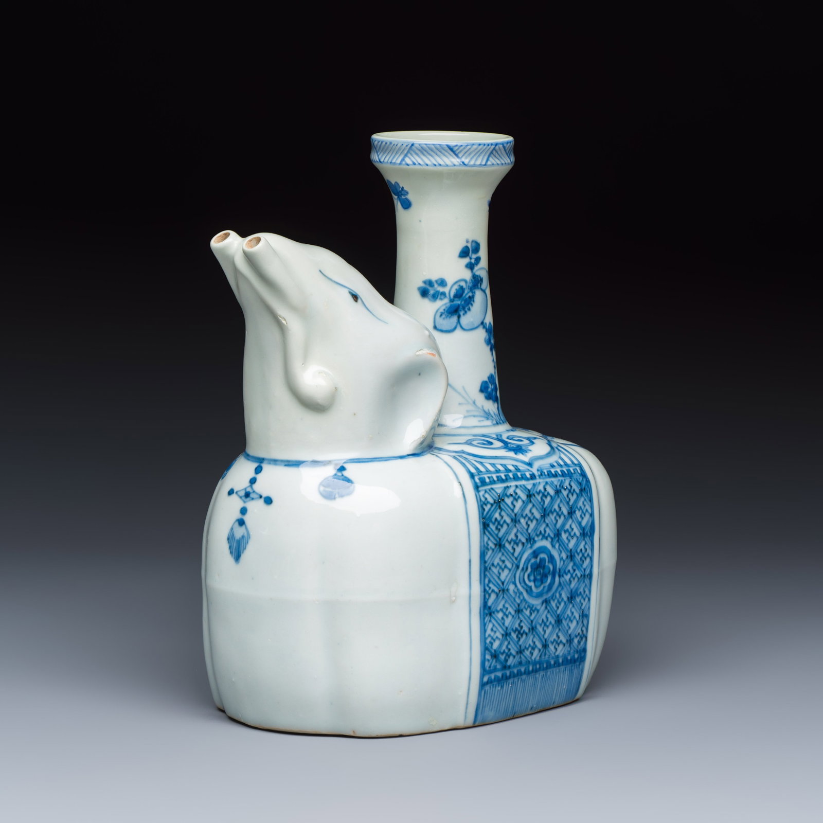 A Chinese blue and white 'Elephant' kendi, Ming: A Chinese blue and white 'Elephant' kendi, Ming Dim: 14,3 x 9,5 x 18,5 cm Provenance: Christie's Amsterdam, 13 December 2012, lot 496 (sold EUR 15.000) A kendi modelled in the form of an elephant, its