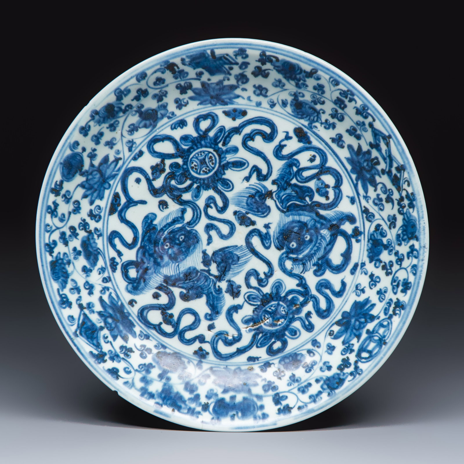 A Chinese blue and white 'Buddhist Lions' dish, Hongzhi/Zhengde (1 of 2)
