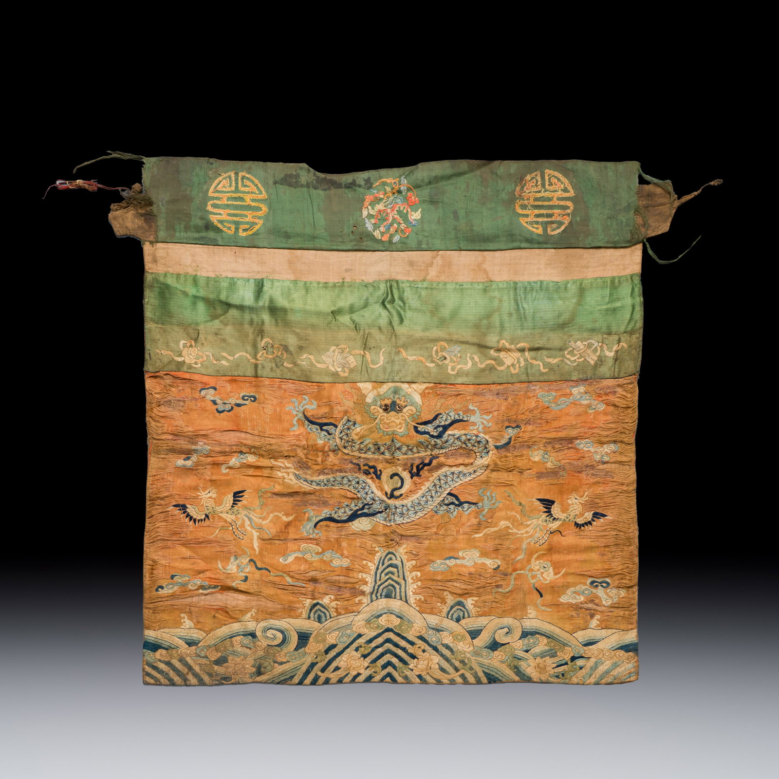 A Chinese embroidered silk 'Dragon and Phoenixes' panel, 19th C. (1 of 2)